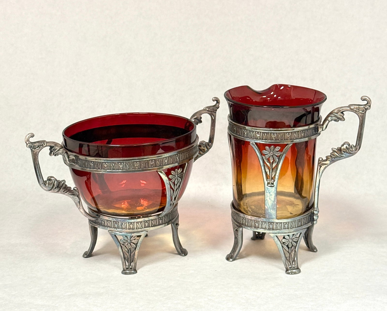 Amberina Sugar and Creamer: Amberina sugar and creamer in holders; ht. 5 3/4". CONDITION: no chips, cracks, repairs, or material defects found, Jaremos attempts to call any material flaw that affects the price, but minor scratch