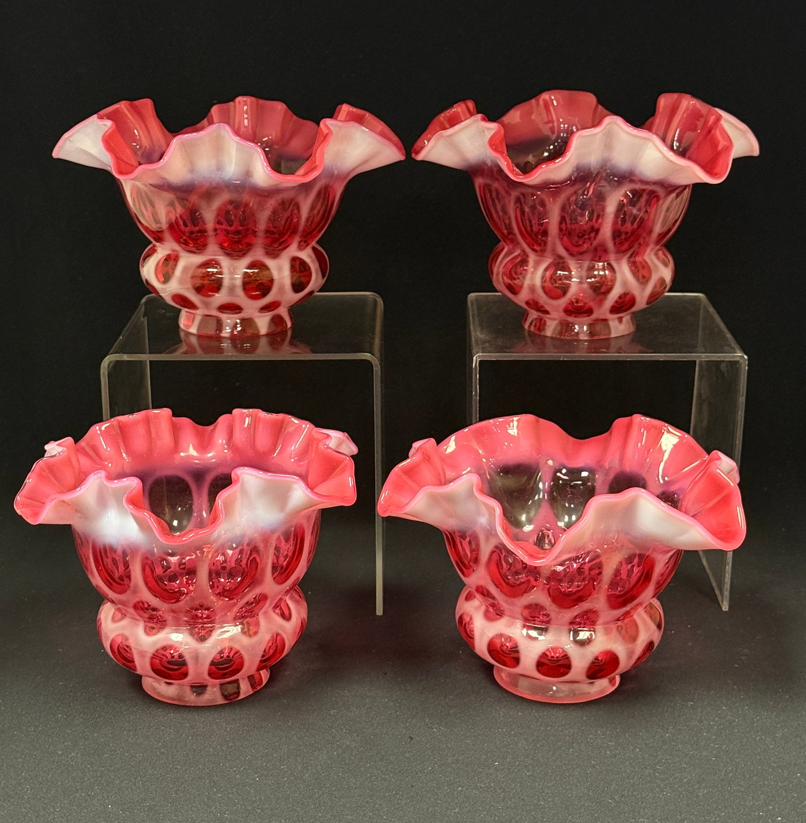 4 Opalescent Cranberry Shades: 4 opalescent oval window pattern cranberry ruffle rim shades; length 4 1/2", fitter diameter 2 1/8". CONDITION: no chips, cracks, repairs, or material defects found, Jaremos attempts to call any mater