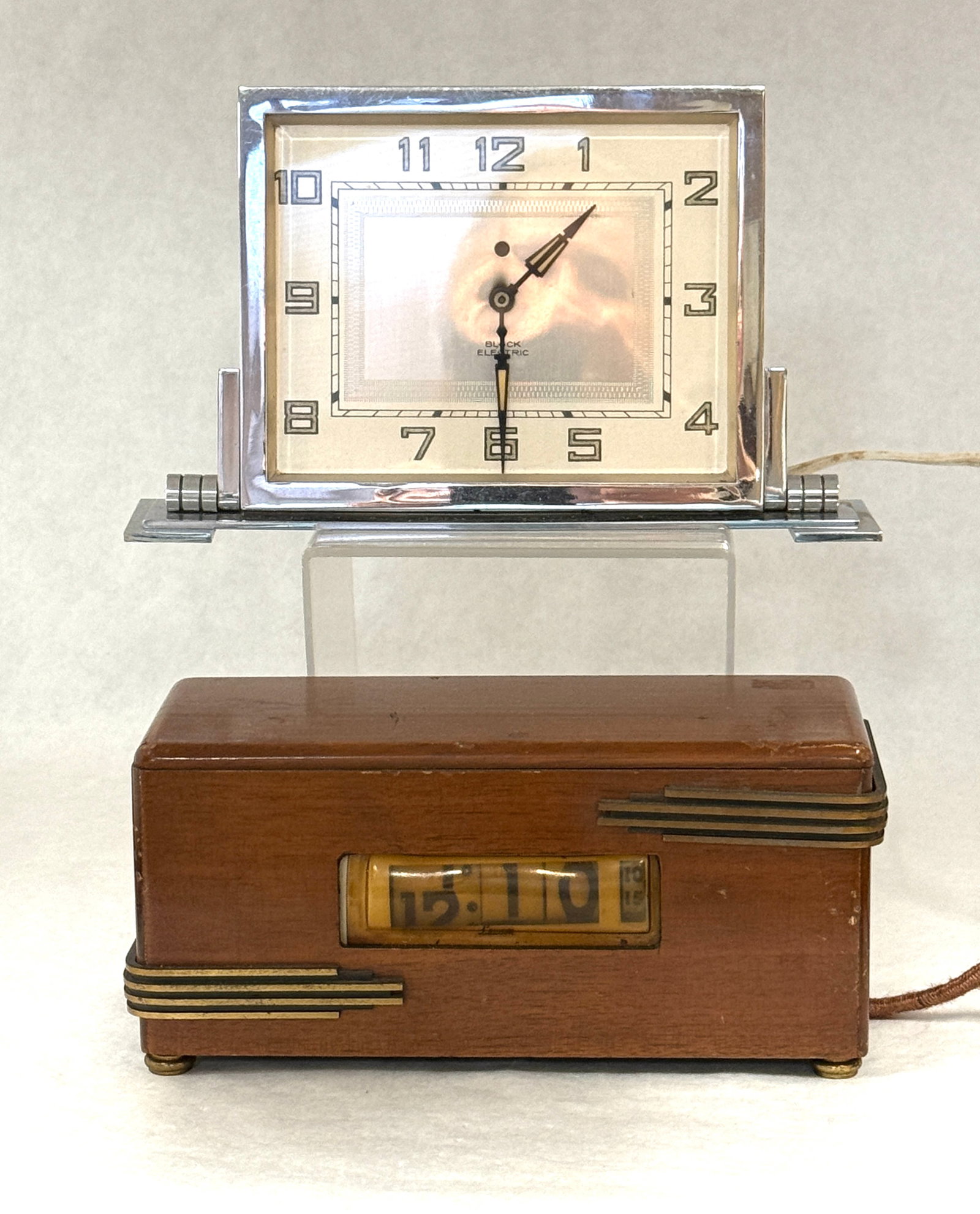 2 Art Deco Clocks: 2 Art Deco desk clocks, one electric Bick Sky Scraper and a Lawson electric clock; length of Bick 8 3/4". CONDITION: not checked for working order.