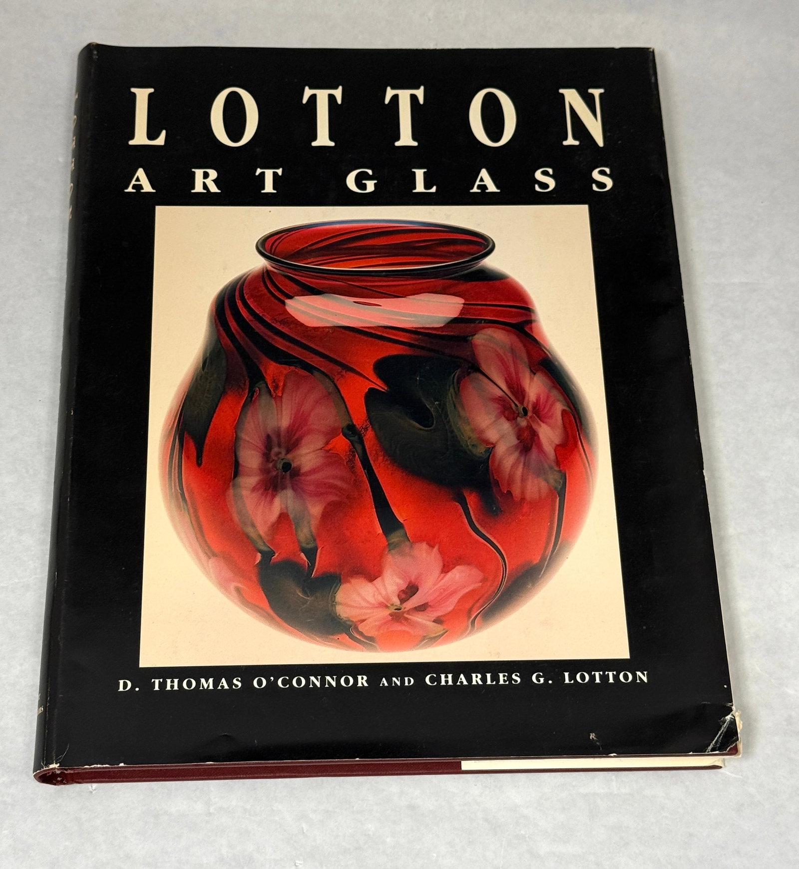 Lotton Art Glass Book: Lotton Art Glass Book. Signed by Charles G. Lotton and John Lotton on inside of cover. CONDITION: some jacket wear.