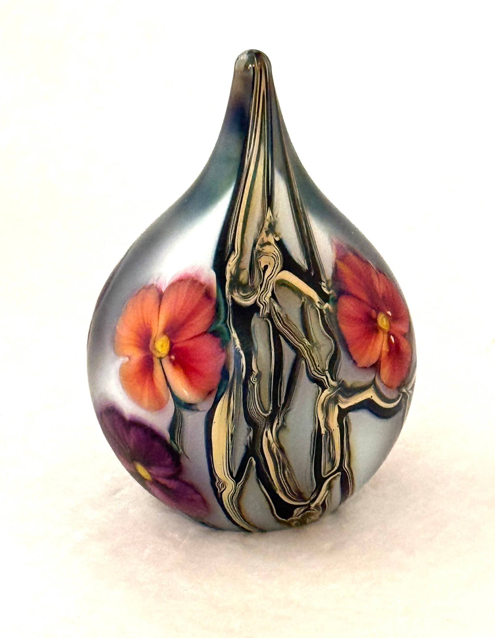 Jeremiah Lotton Paperweight: Jeremiah Lotton tear drop shape multi-floral with variegated leaves paperweight, signed Jeremiah Lotton 2006; ht. 4". CONDITION: no chips, cracks, repairs or material defects found, Jaremos attempts t