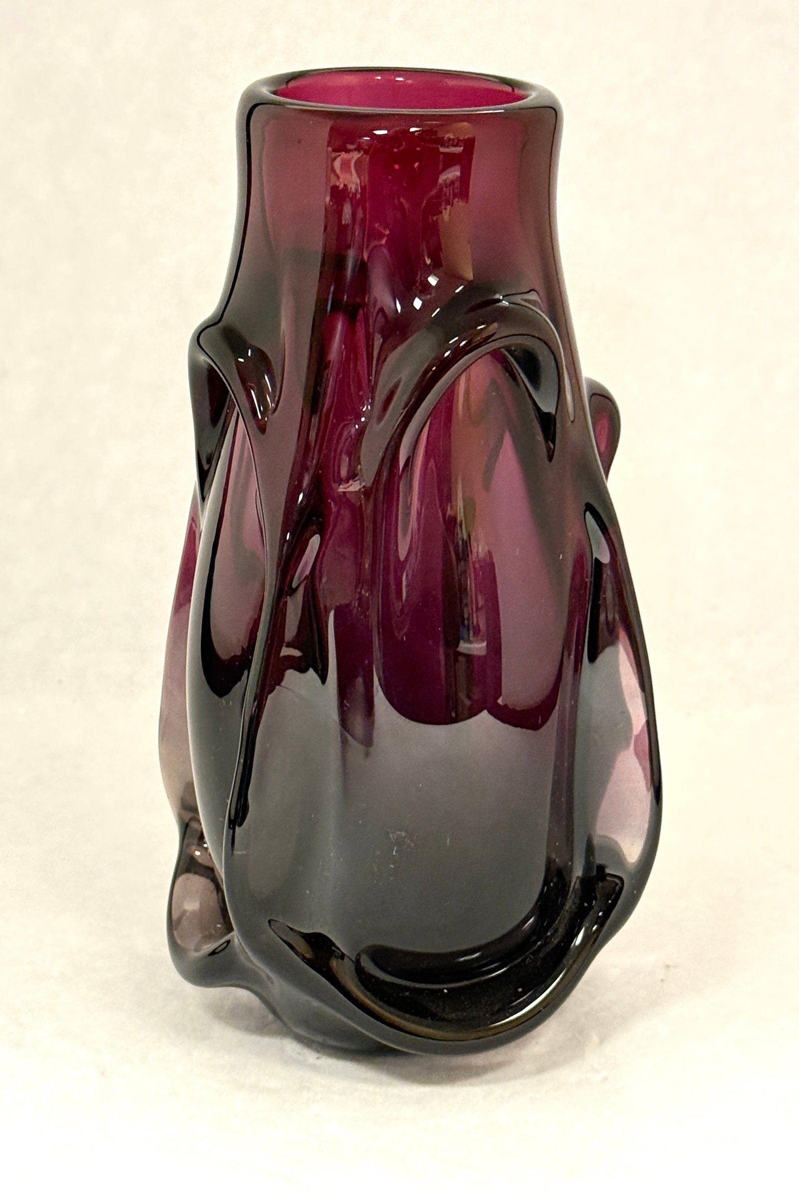 Labino Amethyst Vase: Labino amethyst vase with heavy rib drippings, signed Labino 9-1974; ht. 7". CONDITION: no chips, cracks, repairs or material defects found, Jaremos attempts to call any material flaw that affects the