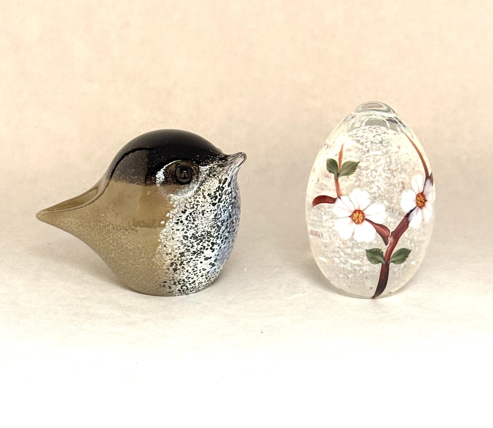 2 Art Glass Paperweights: 2 Art glass paperweights including a signed Douglas Becker bird, and a signed Chris Sherwin translucent egg with dogwood flower, tallest 3 1/2" ht. CONDITION: no chips, cracks, repairs, or material de