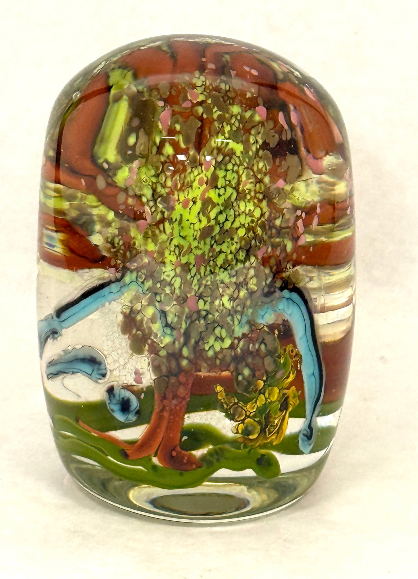 Dome Shaped Paperweight: Dome shaped paperweight with interior trees, artist signed; ht. 4 1/4". CONDITION: no chips, cracks, repairs, or material defects found, Jaremos attempts to call any material flaw that affects the