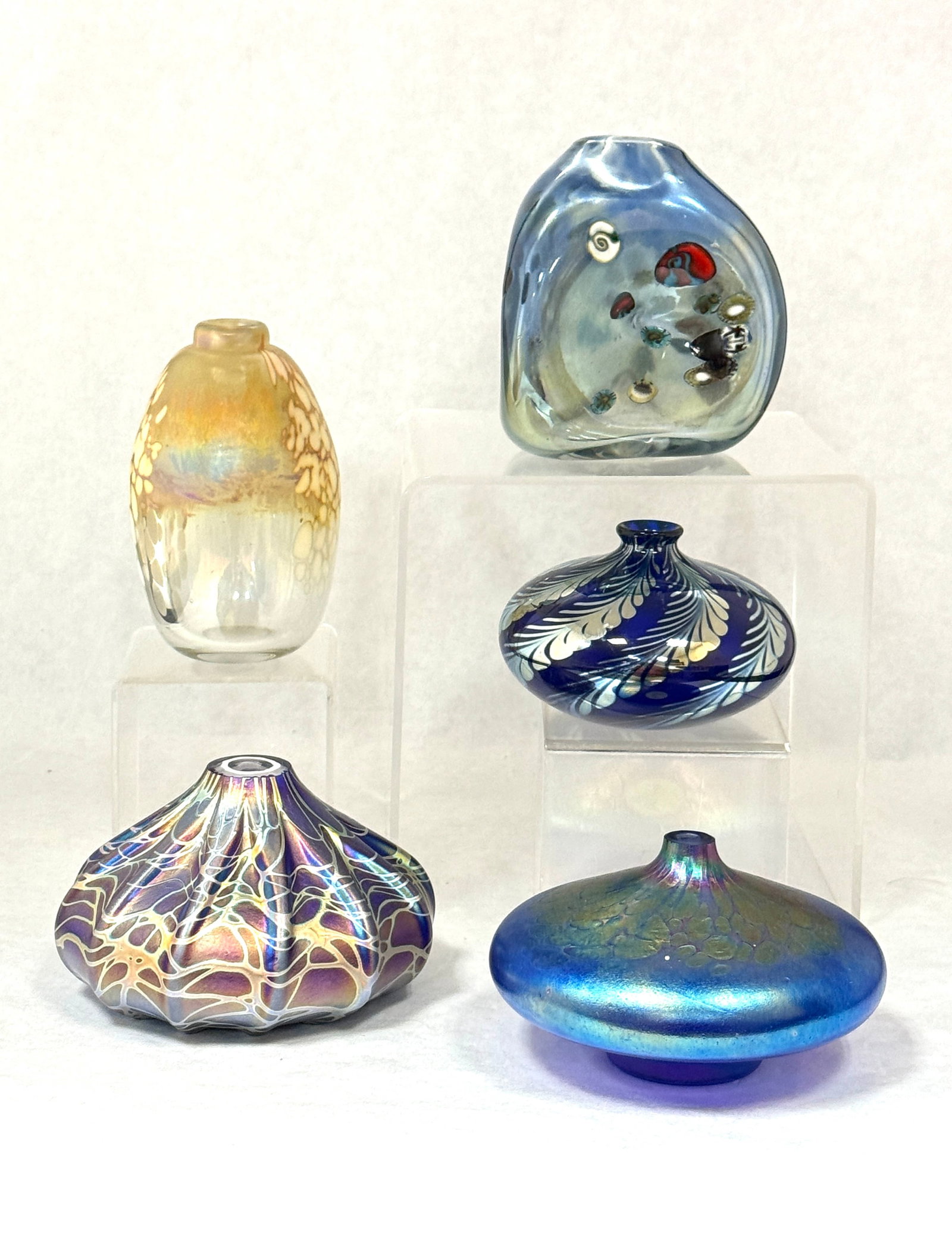 5 Contemporary Oil Lamps: 5 Contemporary oil lamps including: an egg shaped gold iridized oil spot signed Mayhem Studios 6-14 1980, a blue iridescent squatty shaped signed Vines '94, a blue and gold iridized squatty shaped