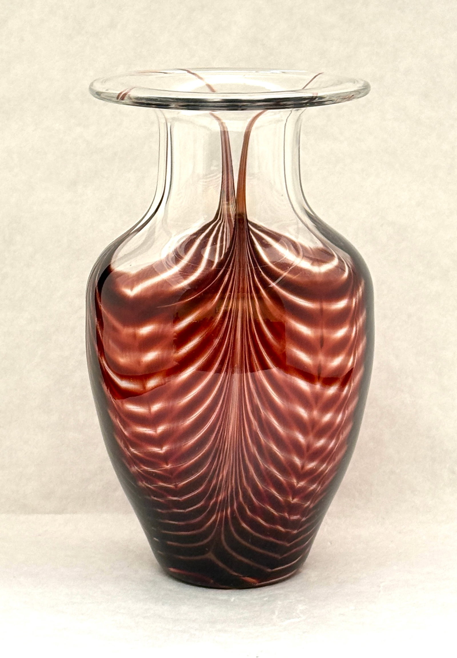 Translucent Vase with Red Swags: Translucent vase with red swags, signed Larson; ht 8 3/4". CONDITION: no chips, cracks, repairs, or material defects found, Jaremos attempts to call any material flaw that affects the price, but