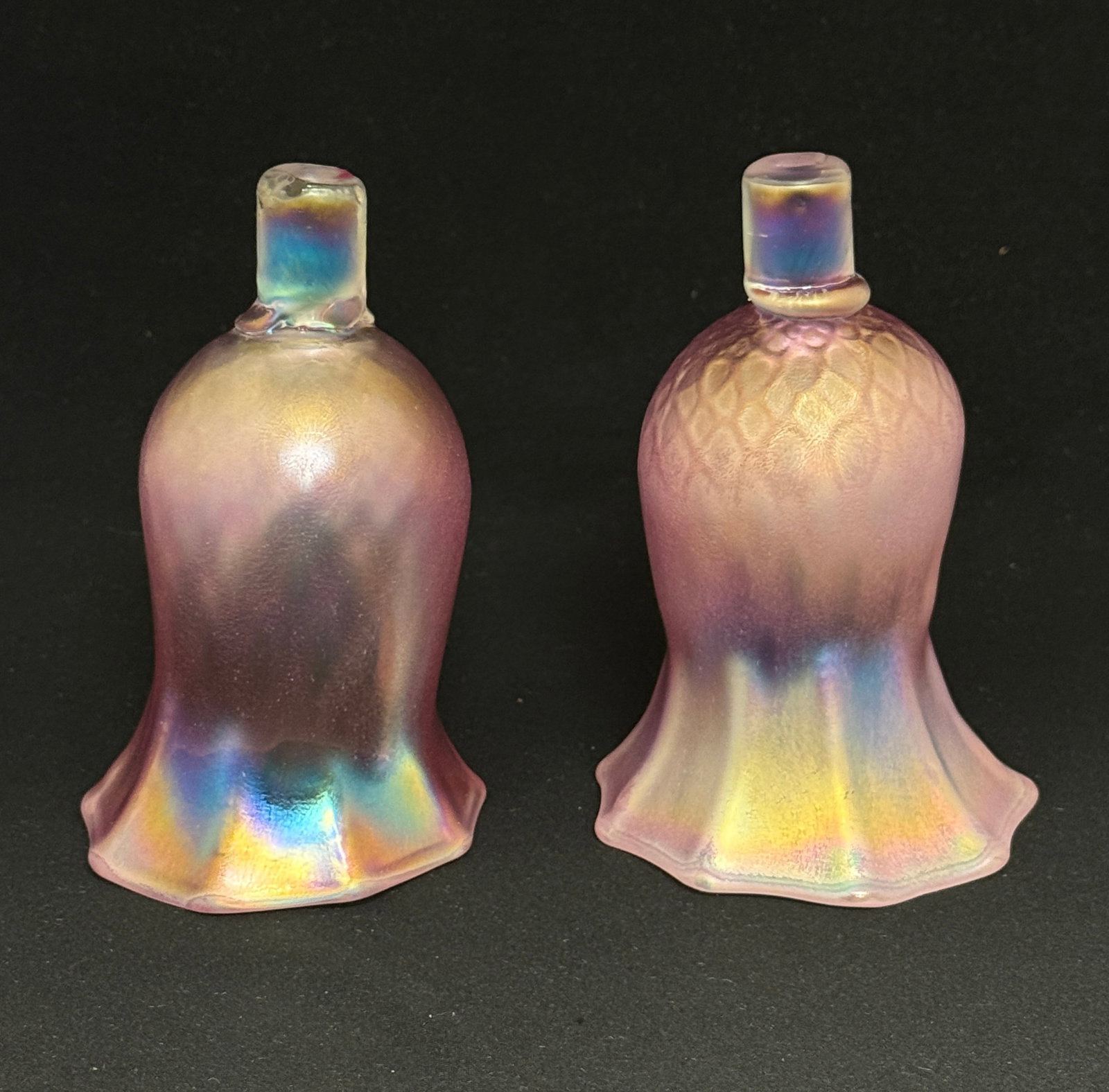 2 Contemporary Torchiere Shades: 2 contemporary pink iridescent torchiere shades; ht. 5 1/4". CONDITION: no chips, cracks, repairs, or material defects found, Jaremos attempts to call any material flaw that affects the price, but min