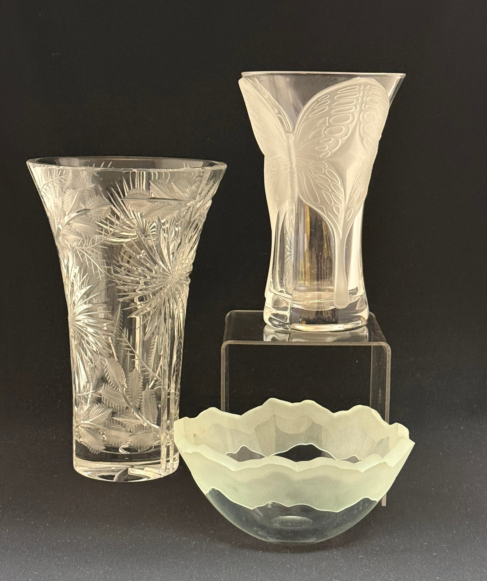 3 Contemporary Crystal Items: 3 Contemporary crystal items, including a butterfly vase, a signed bowl with frosted rim and a Palm tree and fern signed flaring vase, tallest 10" ht. CONDITION: no chips, cracks, repairs, or
