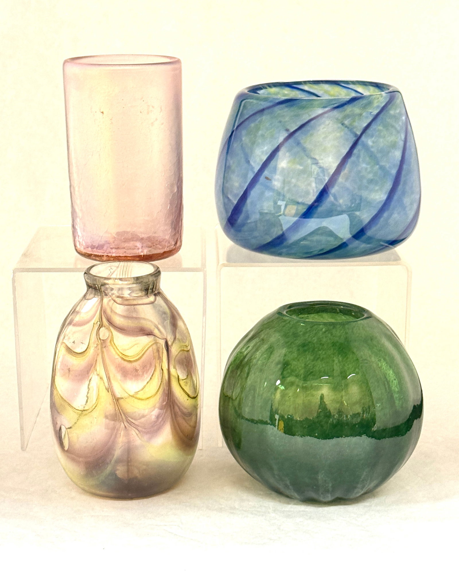 4 Artist Signed Glass Items: 4 artist signed glass items including a purple iridescent tumbler a green Kim Fitzpatric ovoid vase, a Hanks purple and yellow drag loop, and a BOG swirled blue and yellow mottled vase, tallest 5 1/2"
