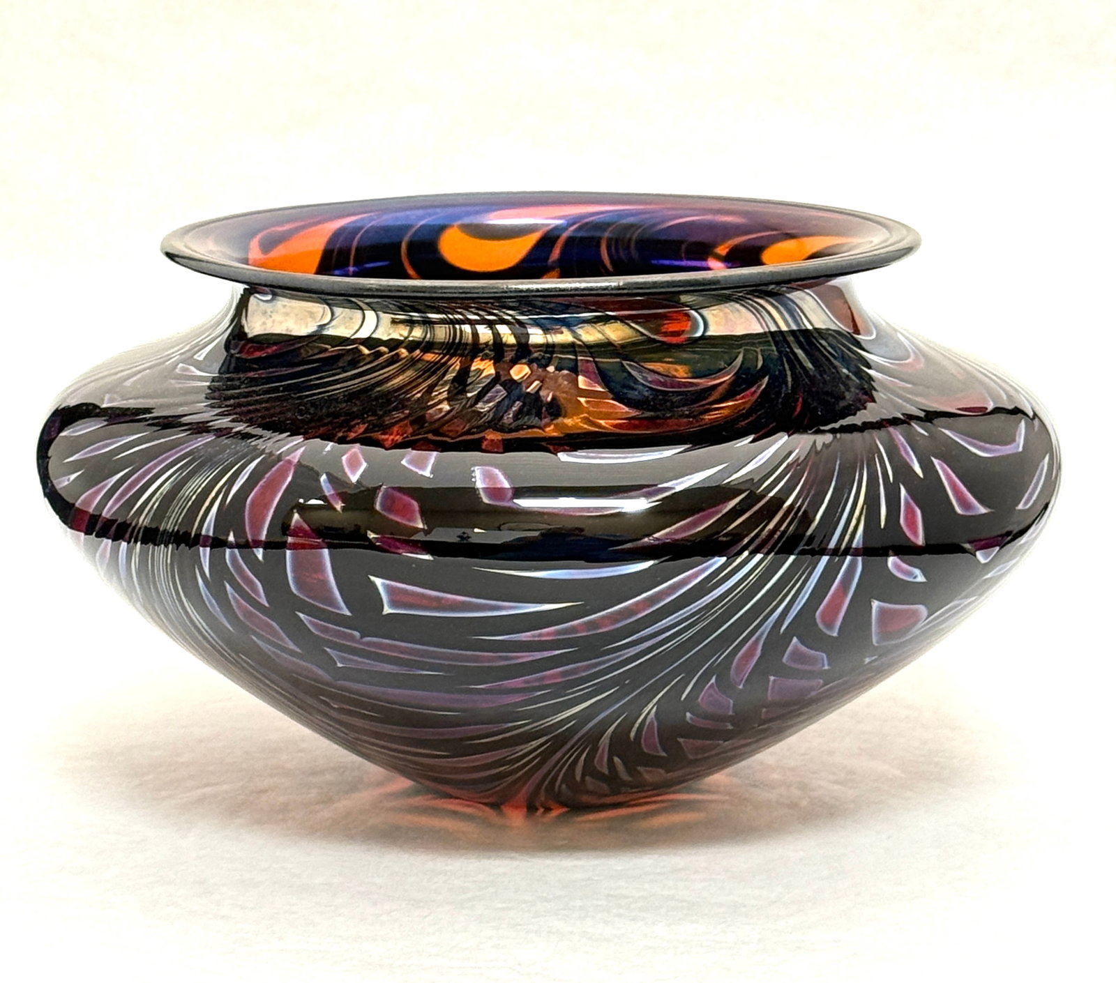 Large Daniel Lotton Web Vase: Large Daniel Lotton bowl form vase in translucent rose decorated with a dark blue and platinum web design, signed Daniel Lotton 1993, 10 1/2" wide. CONDITION: no chips, cracks, repairs, or material de