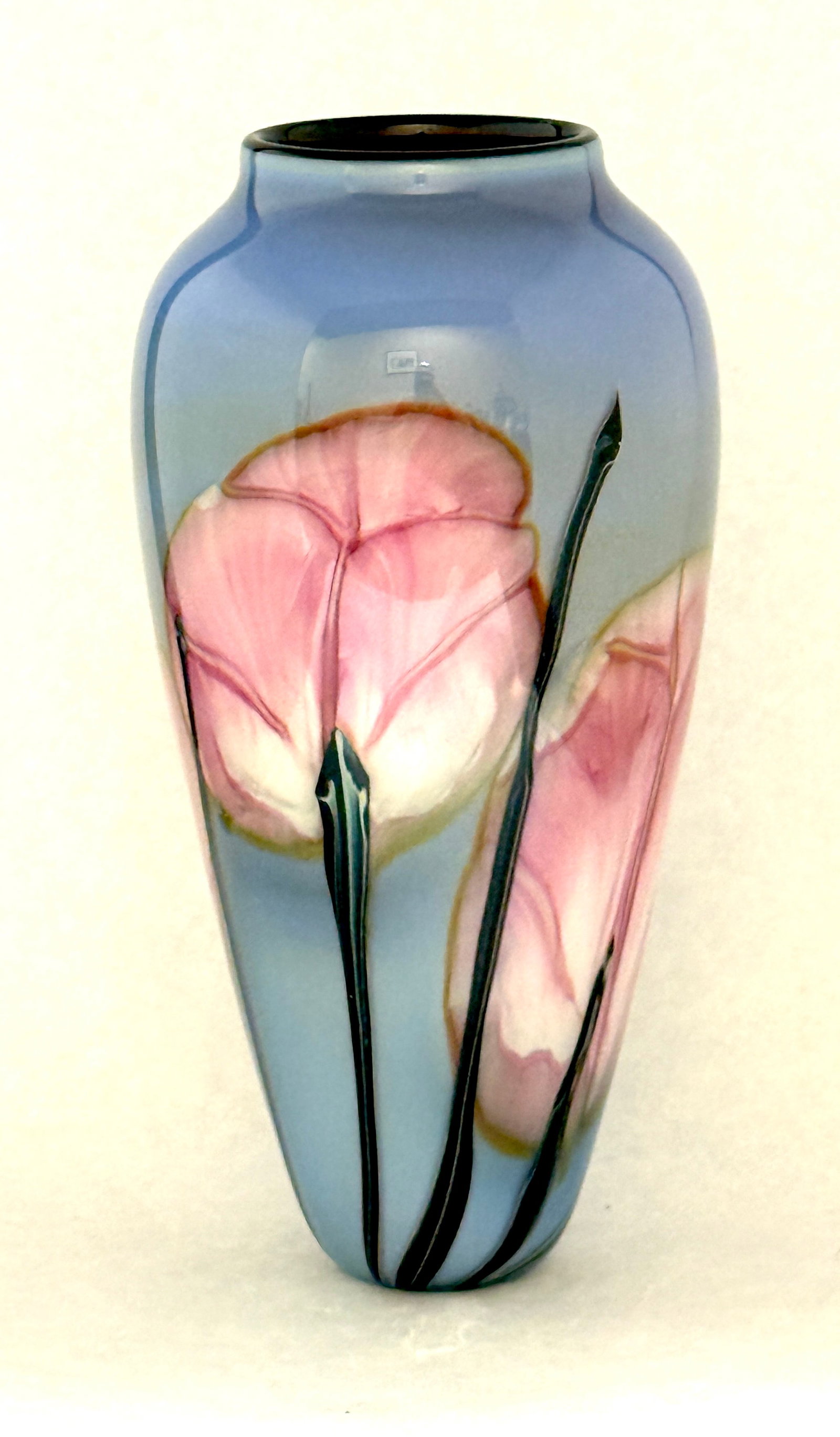 Rick Satava Pink Poppy Vase: Rick Satava glass vase with long stemmed pink poppies set on a baby blue background, signed Satava 475-94, 9 3/4" ht. CONDITION: no chips, cracks, repairs, or material defects found, Jaremos attempts