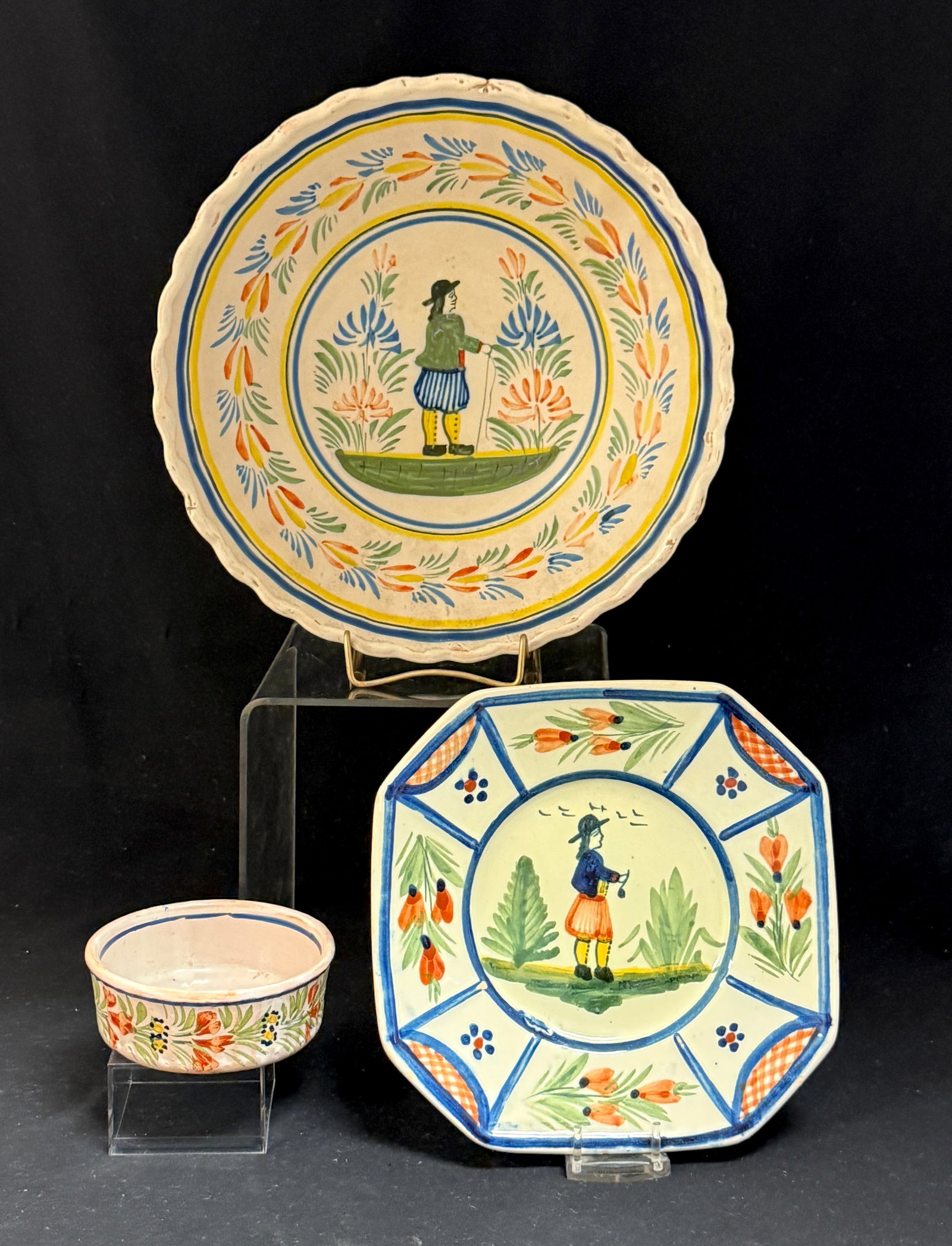 3 Quimper French Faience Items: 3 Quimper French faience items including a commissioned by "Macy's" bread and butter plate, a Fireside ramekin and a Kenilworth bowl; bowl diameter 9 1/2". 2 HenRiot Quimper yellow and blue banding di