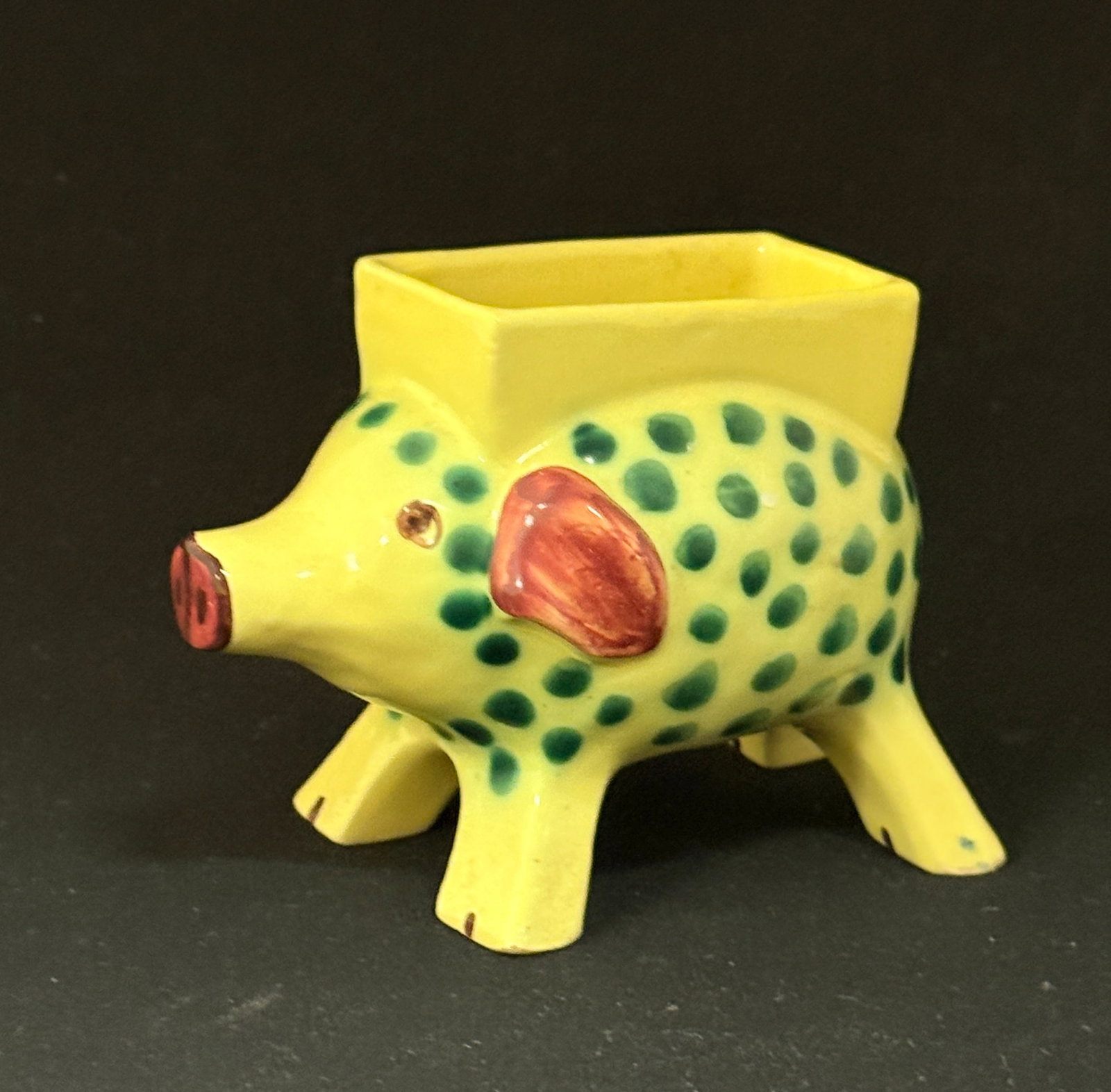 HB Quimper Polka Dot Pig: HB Quimper polka dot pig, yellow, green and rose; ht. 3" circa 1920-1950. CONDITION: Quimper has propensity to have minor chips, glaze loss/wear and crazing. Jaremos attempts to call any material