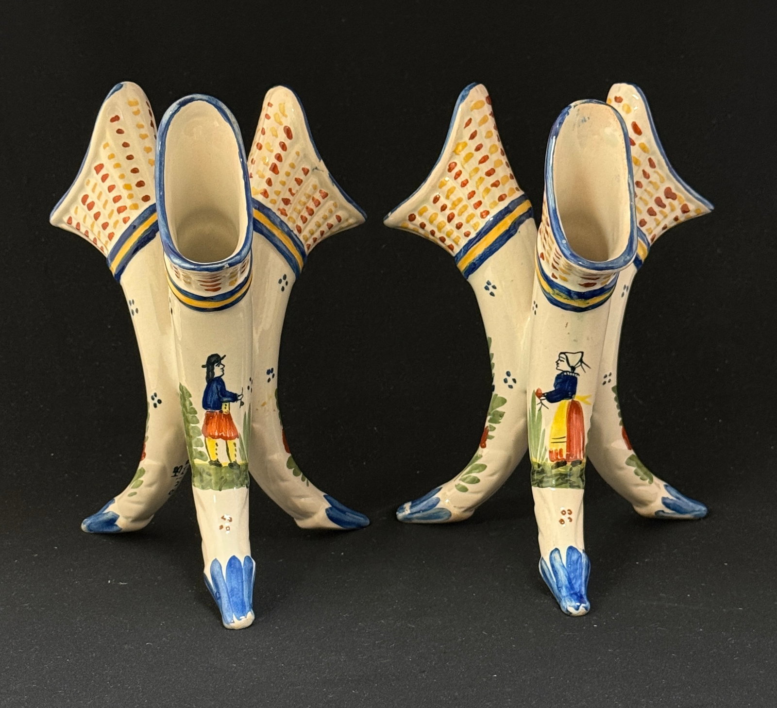 Pair HB Quimper Tri-corner Vases: Pair HB Quimper tri-cornered vases with Breton, Bretonne, 4 dot motif and floral sprays; ht. 8 3/4" circa 1904-1950. CONDITION: Quimper has propensity to have minor chips, glaze loss/wear and