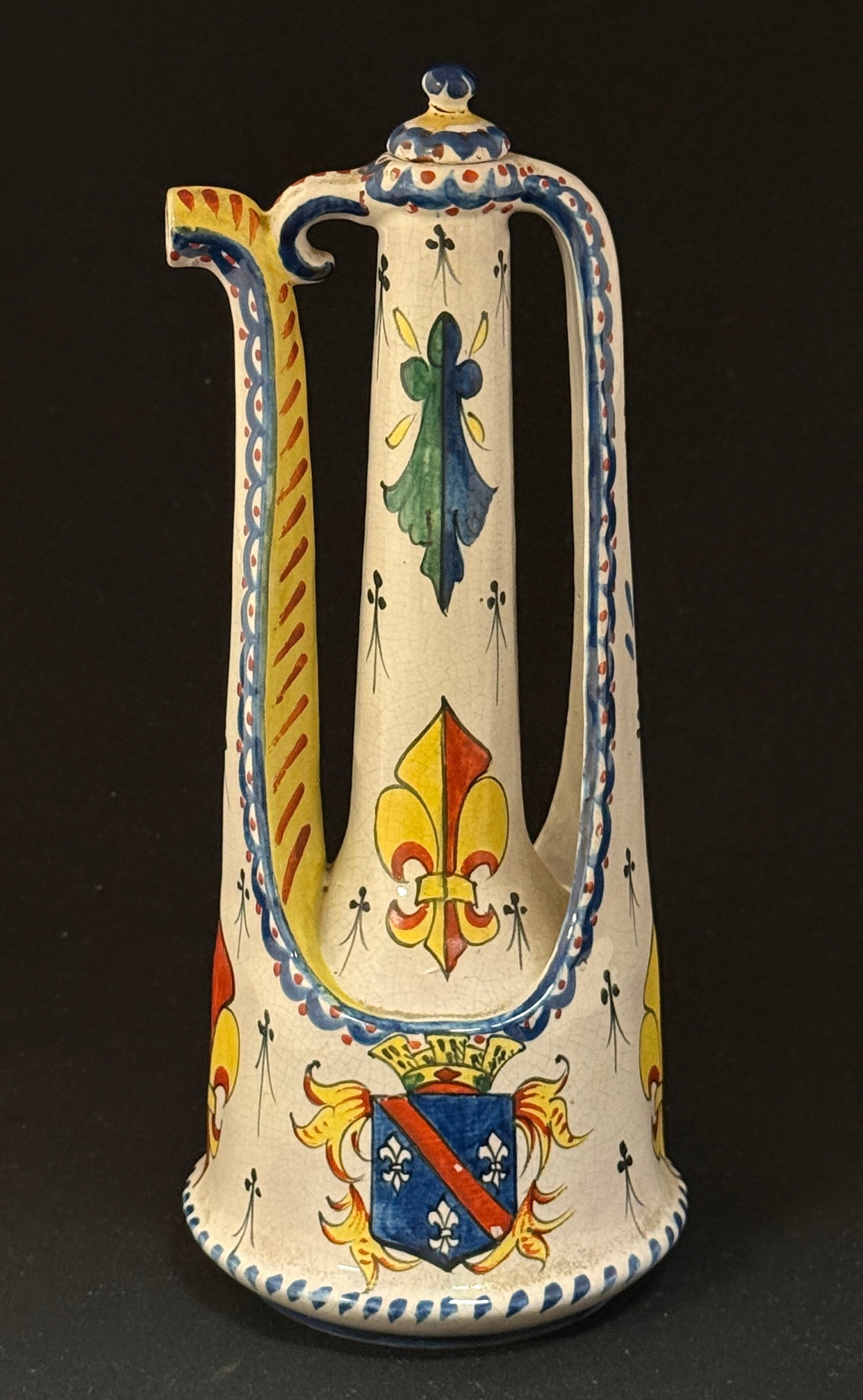 CA Turkish Style Tea Pot: Alcide Chaumeil Turkish style tea pot with blason, fleur de lis and ermine tail motifs #668; ht. 10 1/2" circa 1880-1919. CONDITION: repaired finial. Quimper has propensity to have minor chips, glaze 