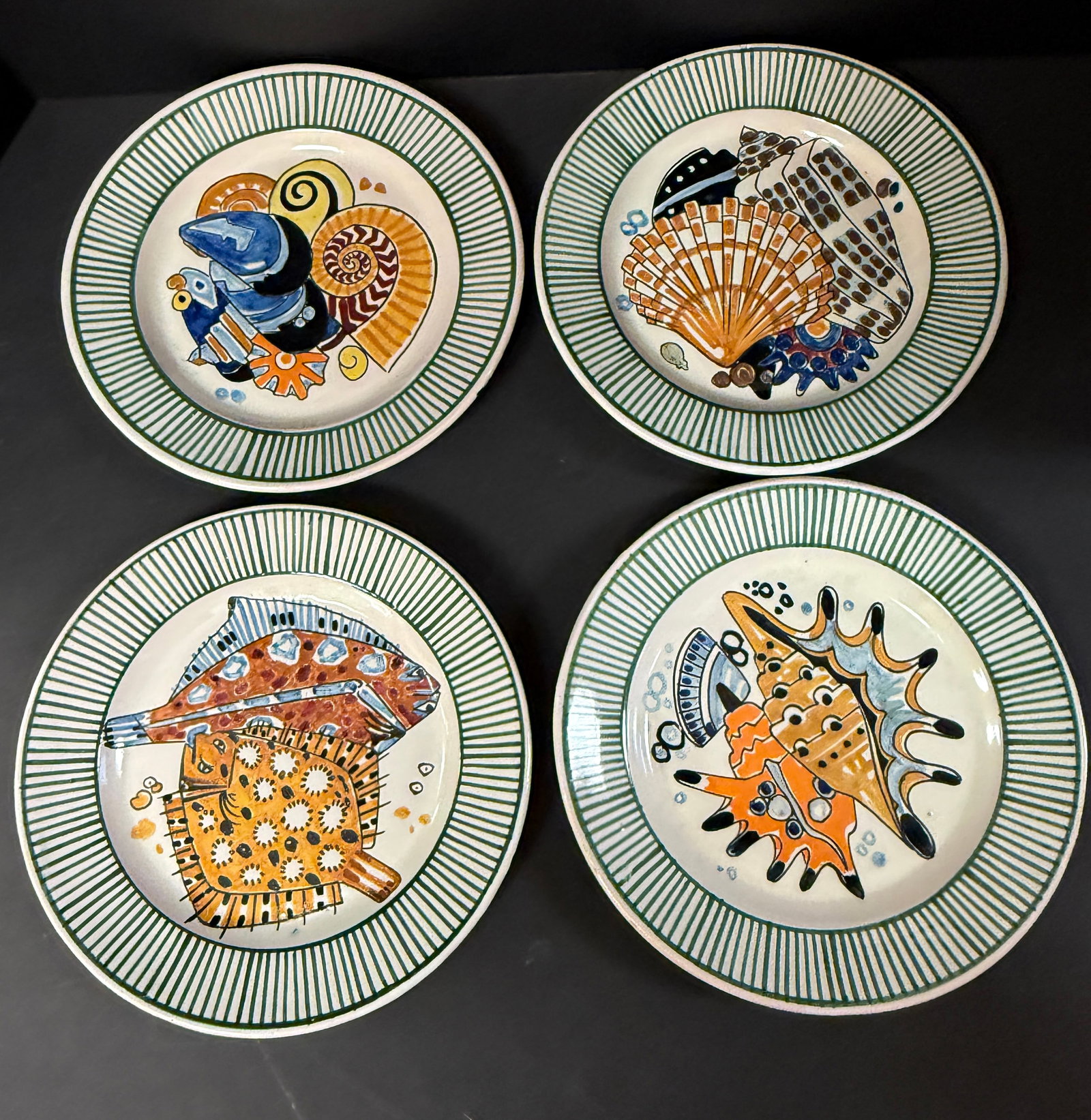 4 Mathurin Meheut La Mer Plates: Set of 4 Mathurin Meheut HenRiot Quimper La Mer plates depicting flounder and shells; diameter 9 1/2" circa 1920. CONDITION: Quimper has propensity to have minor chips, glaze loss/wear and crazing. Ja