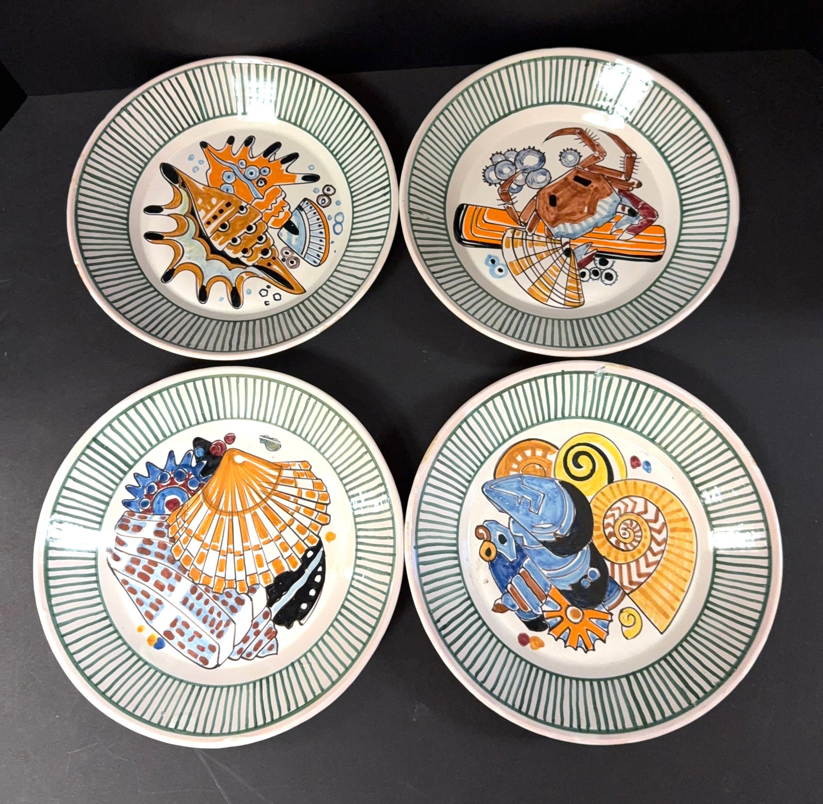 4 Mathurin Meheut Deep Plates: Set of 4 Mathurin Meheut HenRiot Quimper La Mer deep plates depicting a crab and seashells; diameter 9 1/2" circa 1920. CONDITION: Quimper has propensity to have minor chips, glaze loss/wear and