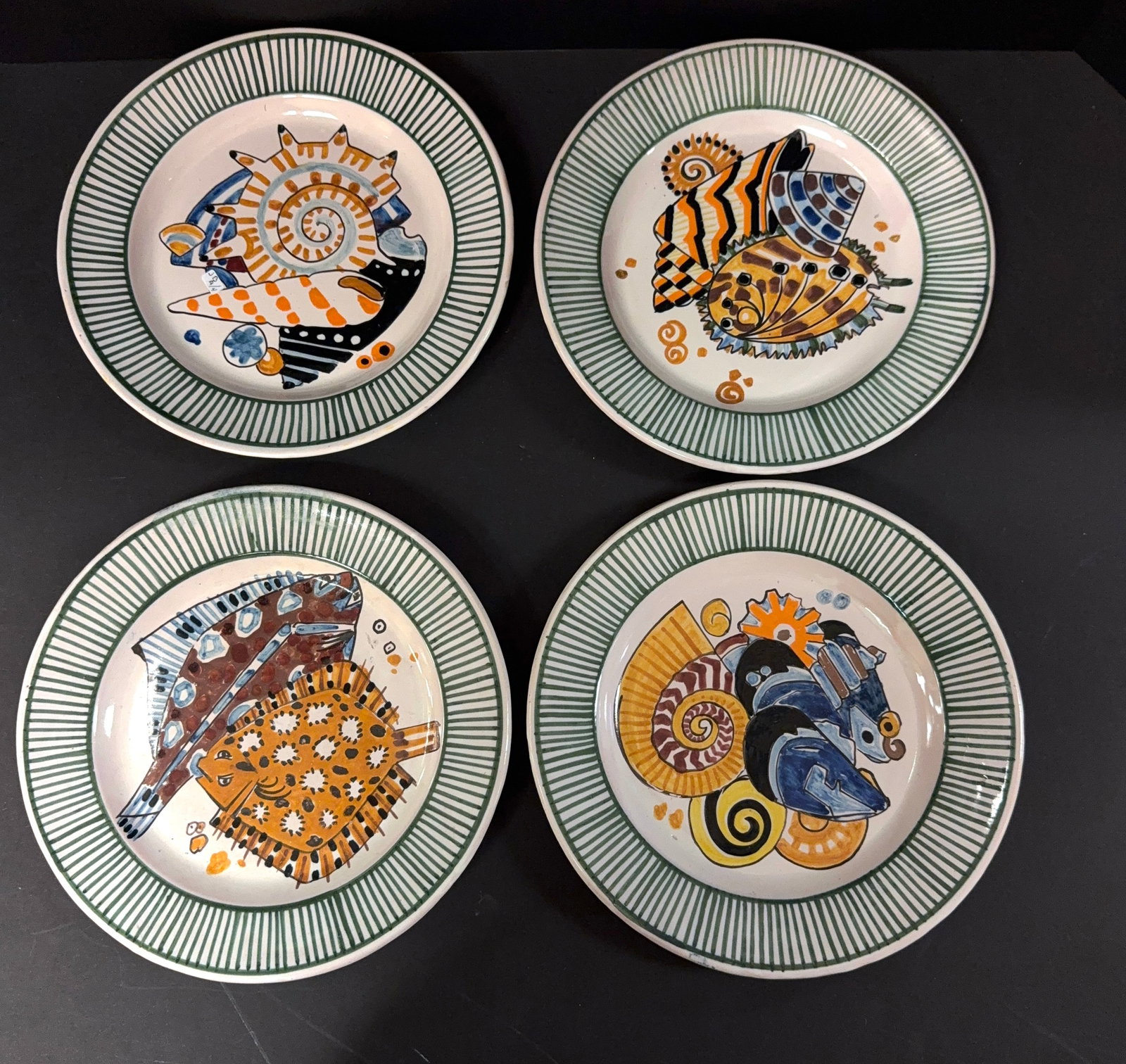 4 Mathurin Meheut La Mer Plates: Set of 4 Mathurin Meheut HenRiot Quimper La Mer plates depicting flounder and shells; diameter 9 1/2" circa 1920. CONDITION: Quimper has propensity to have minor chips, glaze loss/wear and crazing. Ja