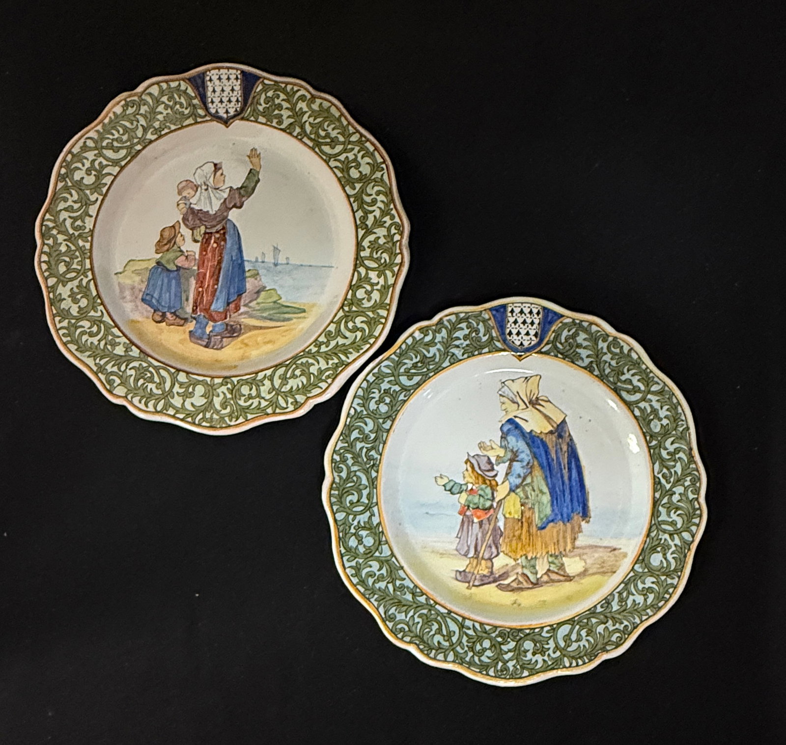 2 Porquier Beau Plates: 2 Porquier Beau plates with decor riche borders, 1) St Servan/Femme Quemeneven LITERATURE: Tome II page 429 Planche No 39. 2) Adieu au Pecheur Trequnc wife and children waving goodbye to fisherman