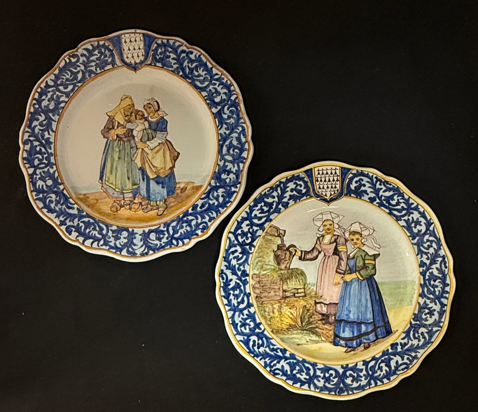 2 Porquier Beau Plates: 2 Porquier Beau plates with decor riche borders 1) Femmes de Trequnc, two young women getting water 2) Rosporden et Pont - l'Abbe LITERATURE: Tome II page 460 Planche No 147; diameter 9 1/4" circa