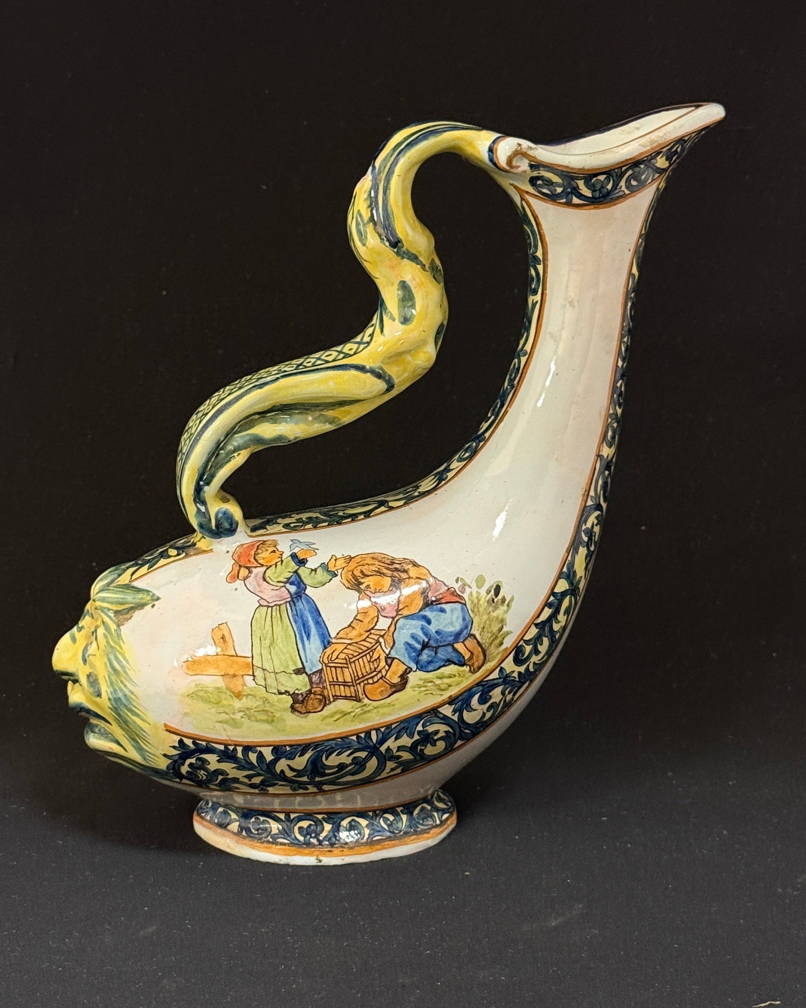 Porquier Beau Dolphin Carafe: Porquier Beau dolphin form carafe marked "Environs de Quimper" with scenes of children with birds and windmill. LITERATURE: Tome II page 440 Planche No 67. ht 9 1/2" circa 1875-1904. CONDITION: