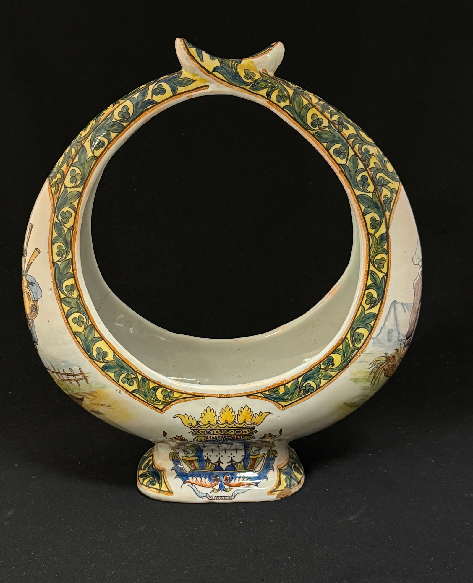Porquier Beau Basket Jardiniere: Porquier Beau crescent shaped footed basket jardiniere with Blasons of Quimper and Brittany, d?cor riche border and Breton and Bretonne flanking the handle. LITERATURE: Tome page 412 Planche No 7