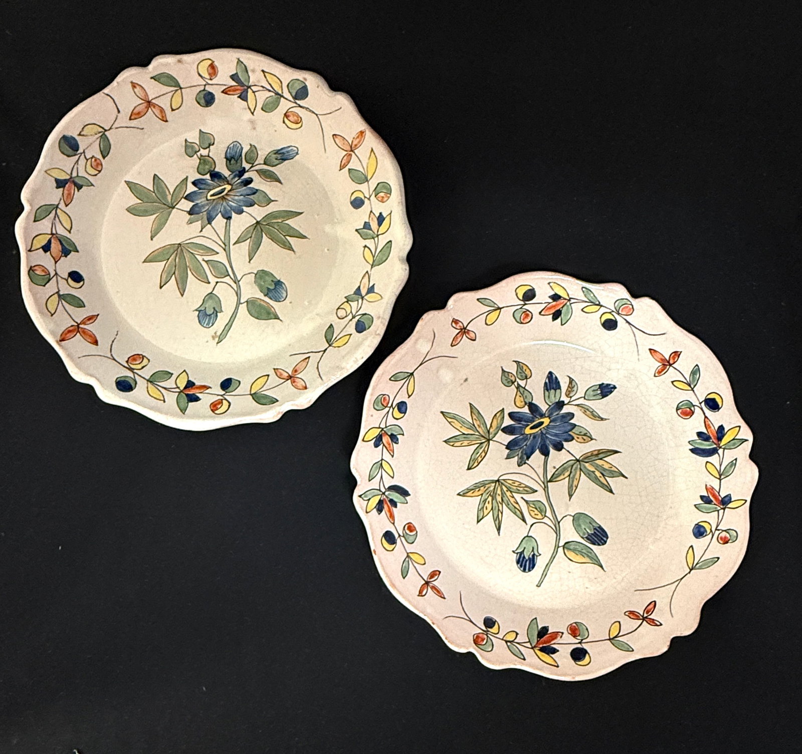 Pair of PBx Malicorne Deep Plates: Pair of PBx Malicorne deep plates with matching blue floral sprays and having traditional Malicorne borders, diameter 9 1/2" circa 1895-1920. CONDITION: Quimper has propensity to have minor chips,