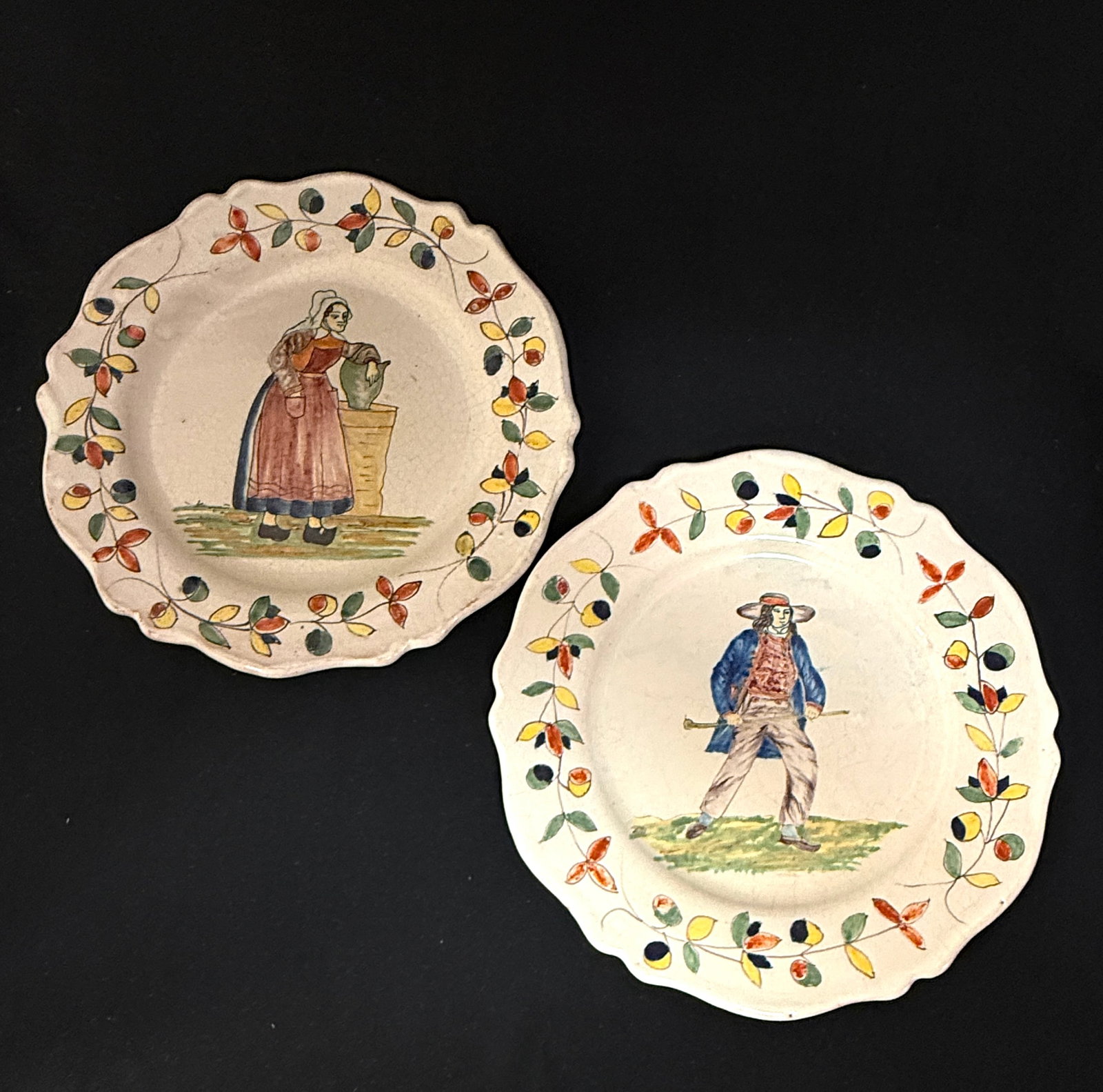 Pouplard Beatrix Malacorne Plates: Pouplard Beatrix PBx Malicorne plates one of a young Breton swinging his walking stick together with a Bretonne resting her crutche on a table both with traditional border, diameter 9 1/2" circa