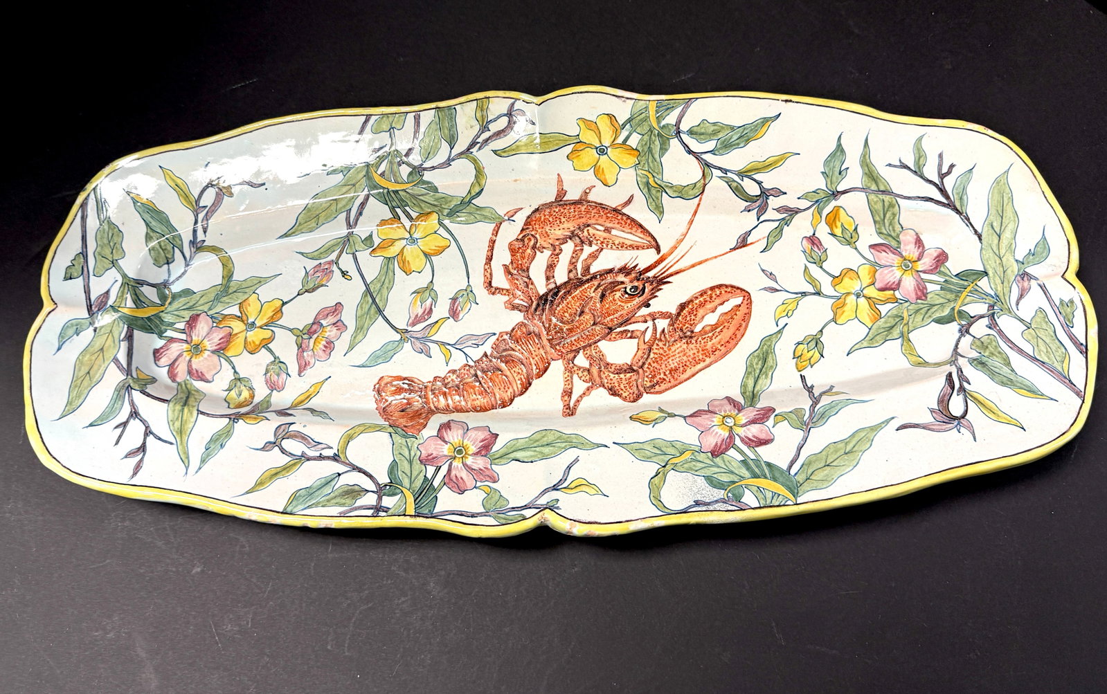Porquier Beau Oval Platter: Porquier Beau oval platter with lobster surrounded by yellow and rose chevrefeville/honey suckle; length 22 1/4" circa 1880. CONDITION: Quimper has propensity to have minor chips, glaze loss/wear and