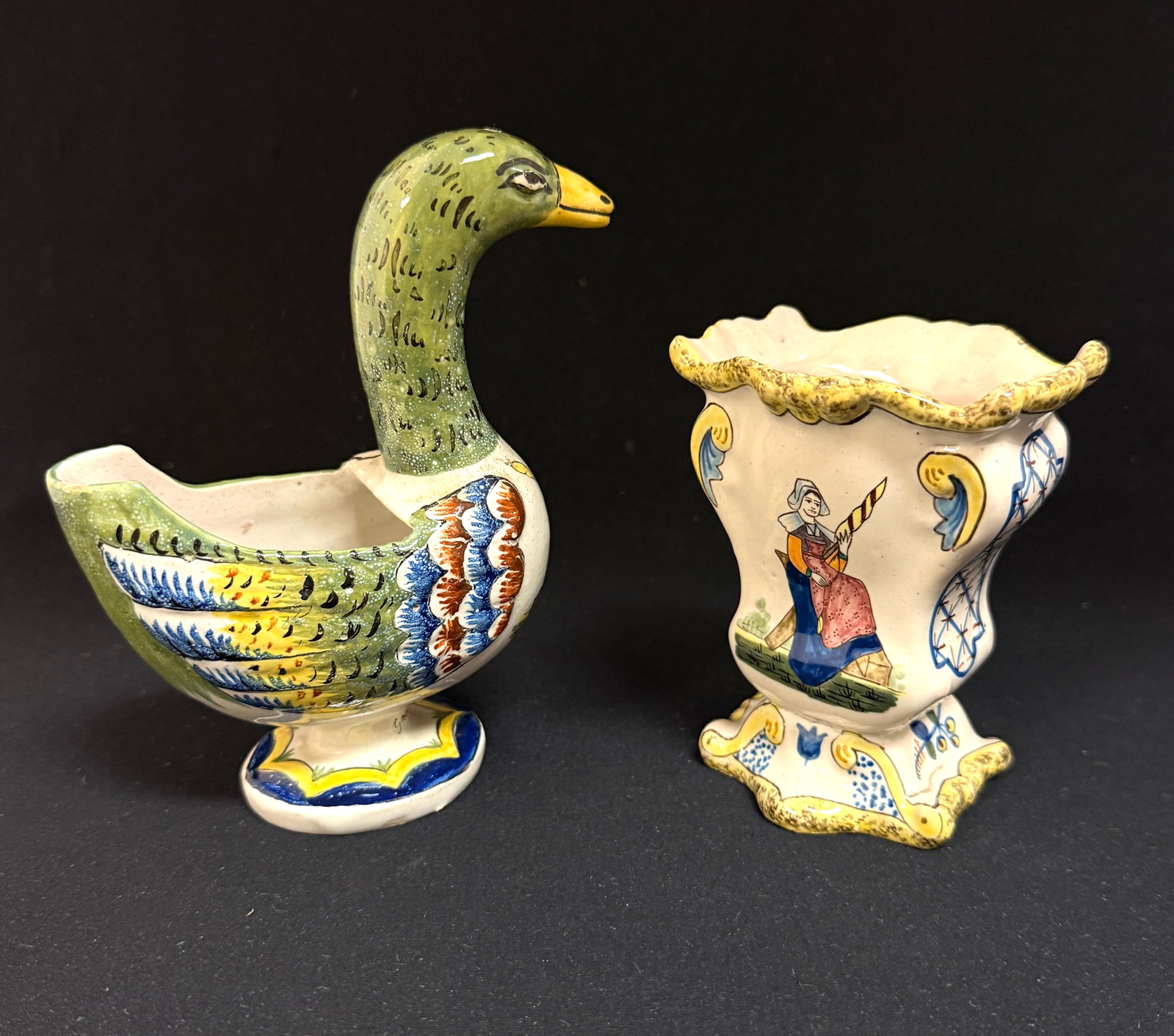 2 HB French Faience Items: 2 HB French faience items 1)small goose vase also marked "Grande Maison" on base 2) petit vase with Breton and Bretonne, crosshatching and sponged details; tallest ht. 5 1/2" circa 1883-1904.