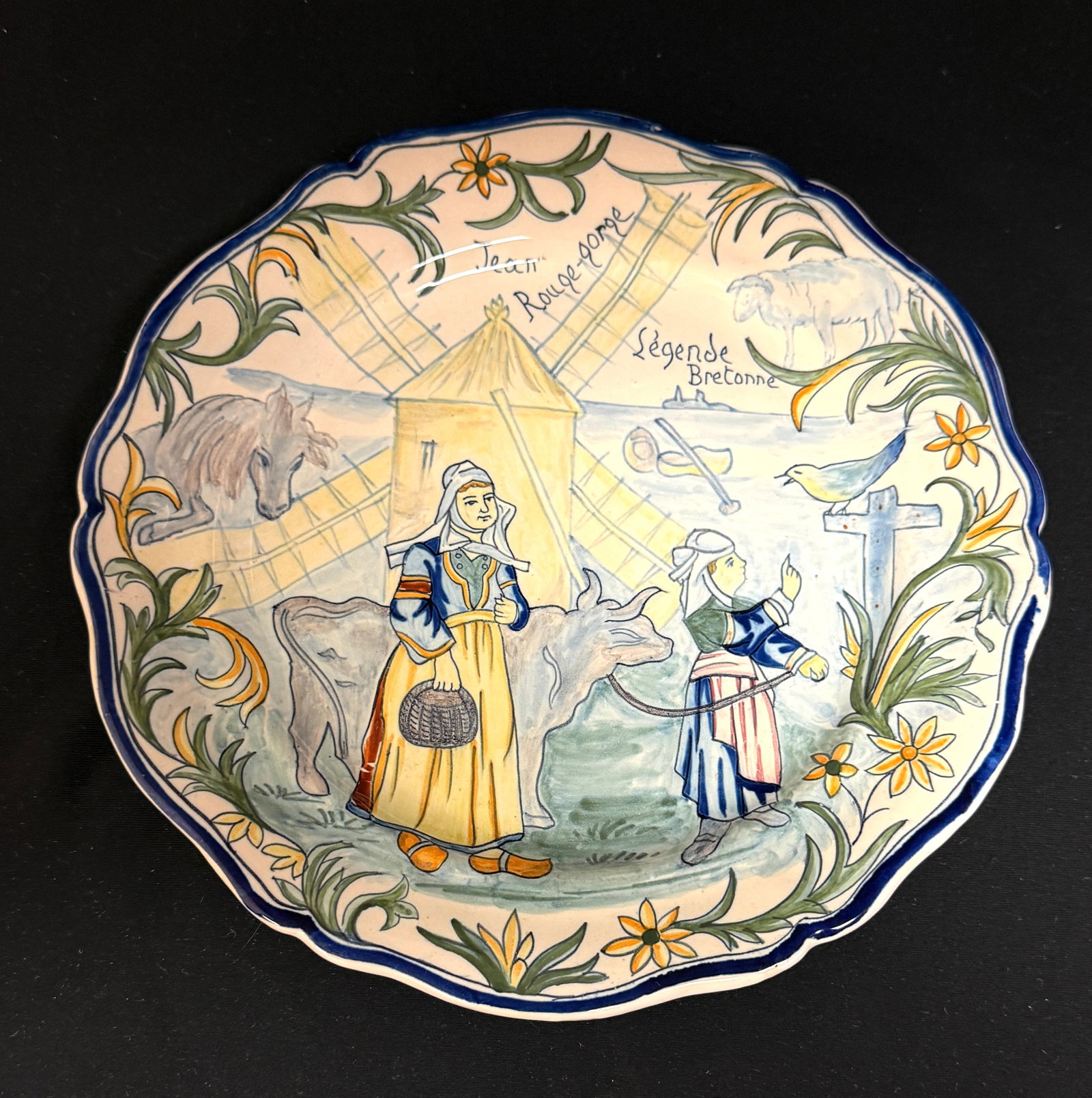 Rare Porquier Beau Quimper Plate: Rare Porquier Beau Beau Quimper "Legend Breton" plate, "Jean Rouge-gorge". A peasant boy named John outwits the sea monster Marc'h Mor, survives dangerous adventures and finds his fortune; diameter 9 
