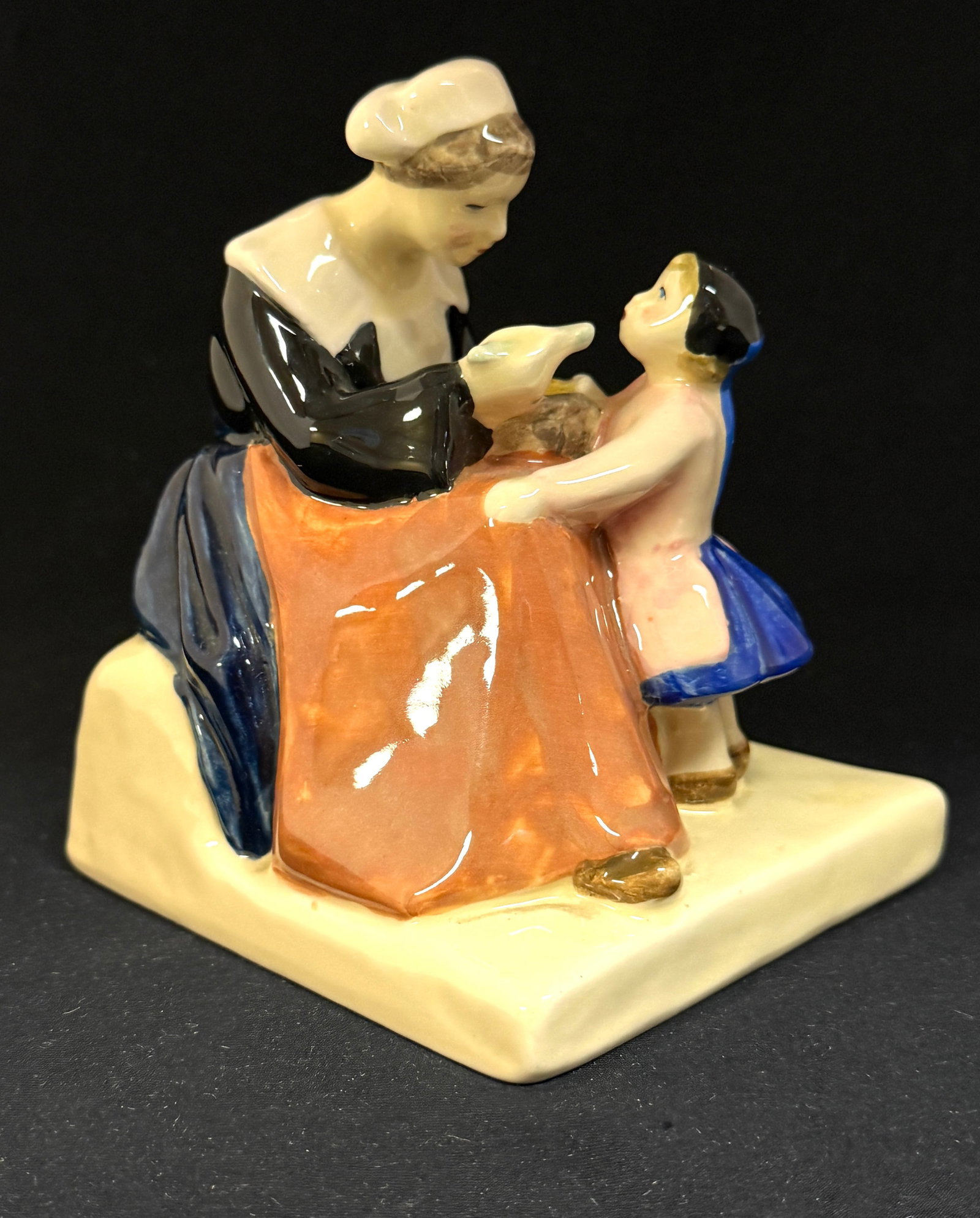 Henriette Porson's Figural: HB Quimper - Henriette Porson's sweet figural of mother feeding her daughter; ht. 5" circa 1925-1950. CONDITION: Quimper has propensity to have minor chips, glaze loss/wear and crazing. Jaremos