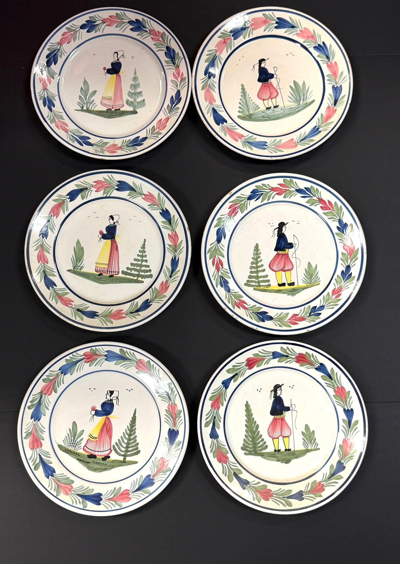 6 HB Quimper Dinner Plates: 6 HB Quimper dinner plates with Breton figures and a la touch? border, foliage, and tree; diameter 10 3/4" circa 1904-1984. CONDITION: Quimper has propensity to have minor chips, glaze loss/wear and