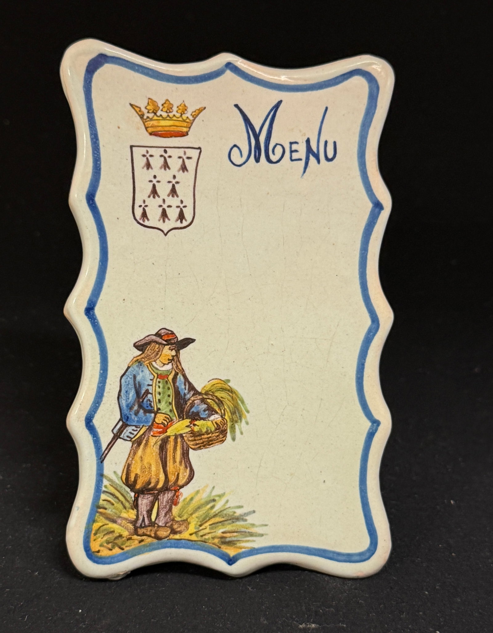 Porquier Beau Porte-Menu: Porquier Beau porte-menu with Blason of Brittany and a Breton holding a basket; ht. 5" circa 1875-1898. CONDITION: Quimper has propensity to have minor chips, glaze loss/wear and crazing. Jaremos