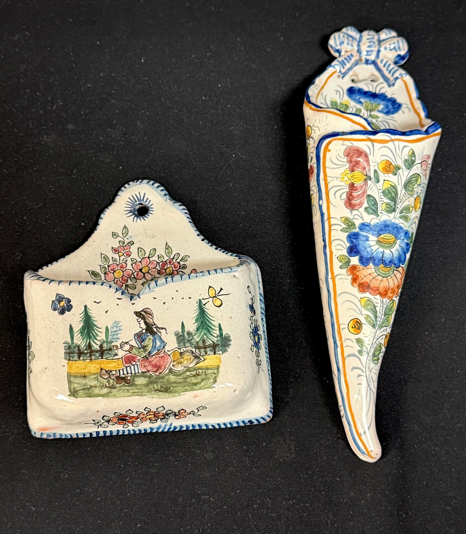 2 French Faience Wall Pockets: 2 French Faience wall pockets 1) LeRoy Dubois Malicorne envelope form with seated Breton, flower and insect motif 2) cone form Nevers wall pocket with beautifully painted flowers and topped with a bow