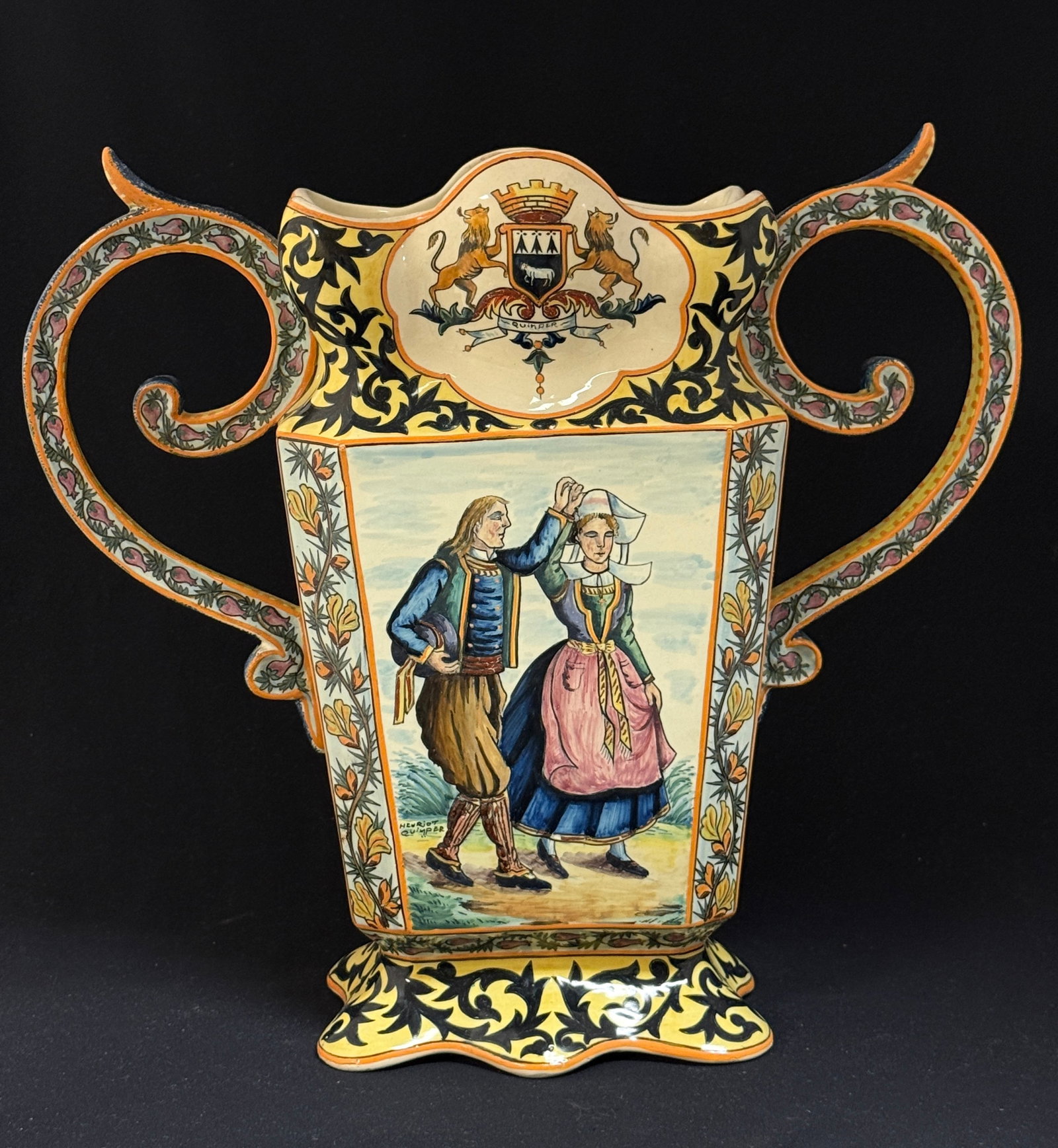 Magnificent HenRiot Quimper Vase: Magnificent HenRiot Quimper vase with large scrolling handles decorated with bruyere, Blasons of Quimper and Brittany, side panels of d?cor riche, topped with band of bruyere, one side panel has