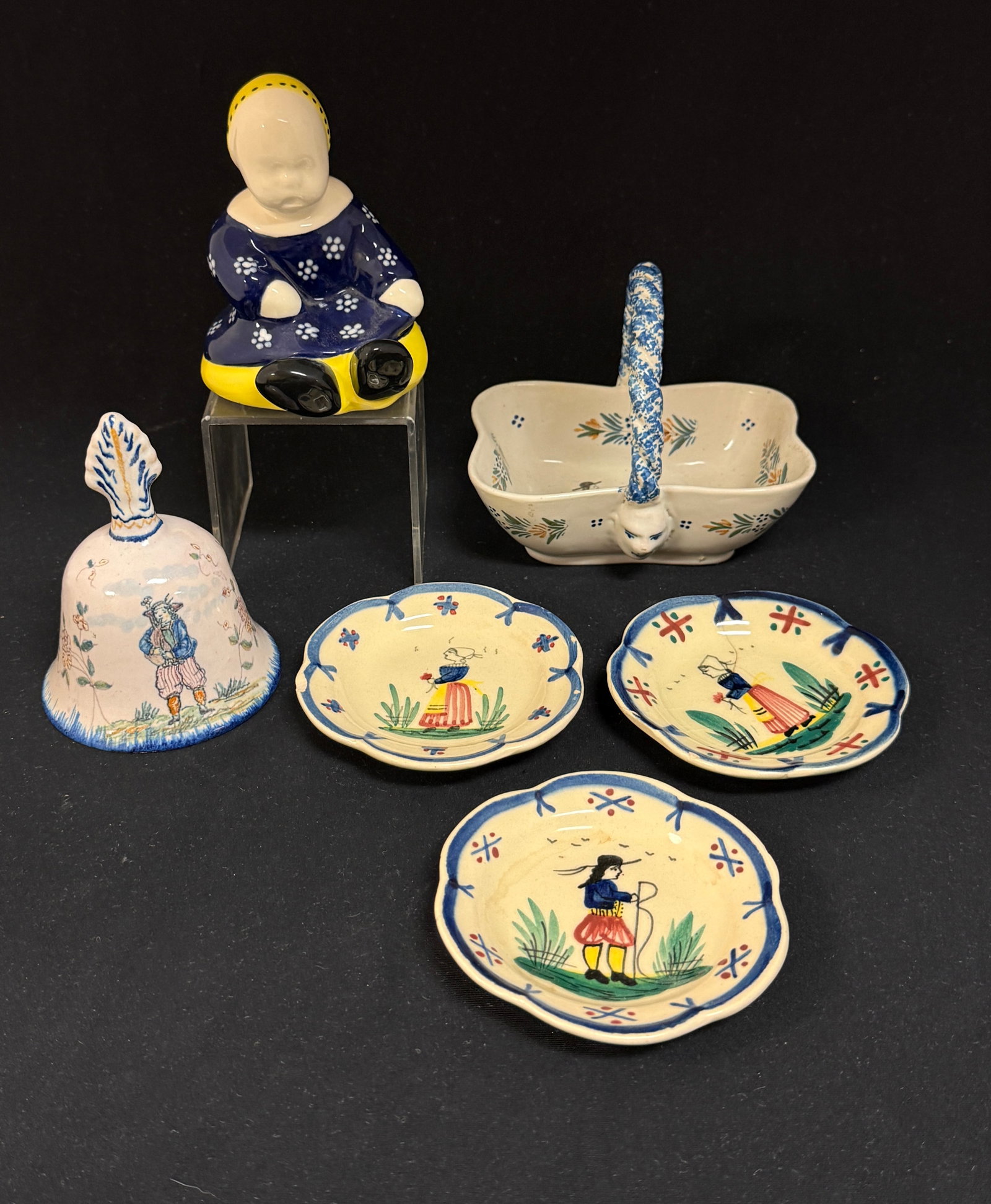 6 French Faience Items: 6 French faience items an HB petite basket with Breton couple, four dot design, a la touch? floral sprays and sponge handle with 3 HB Quimper butter pats with Breton figures with a delicately painted