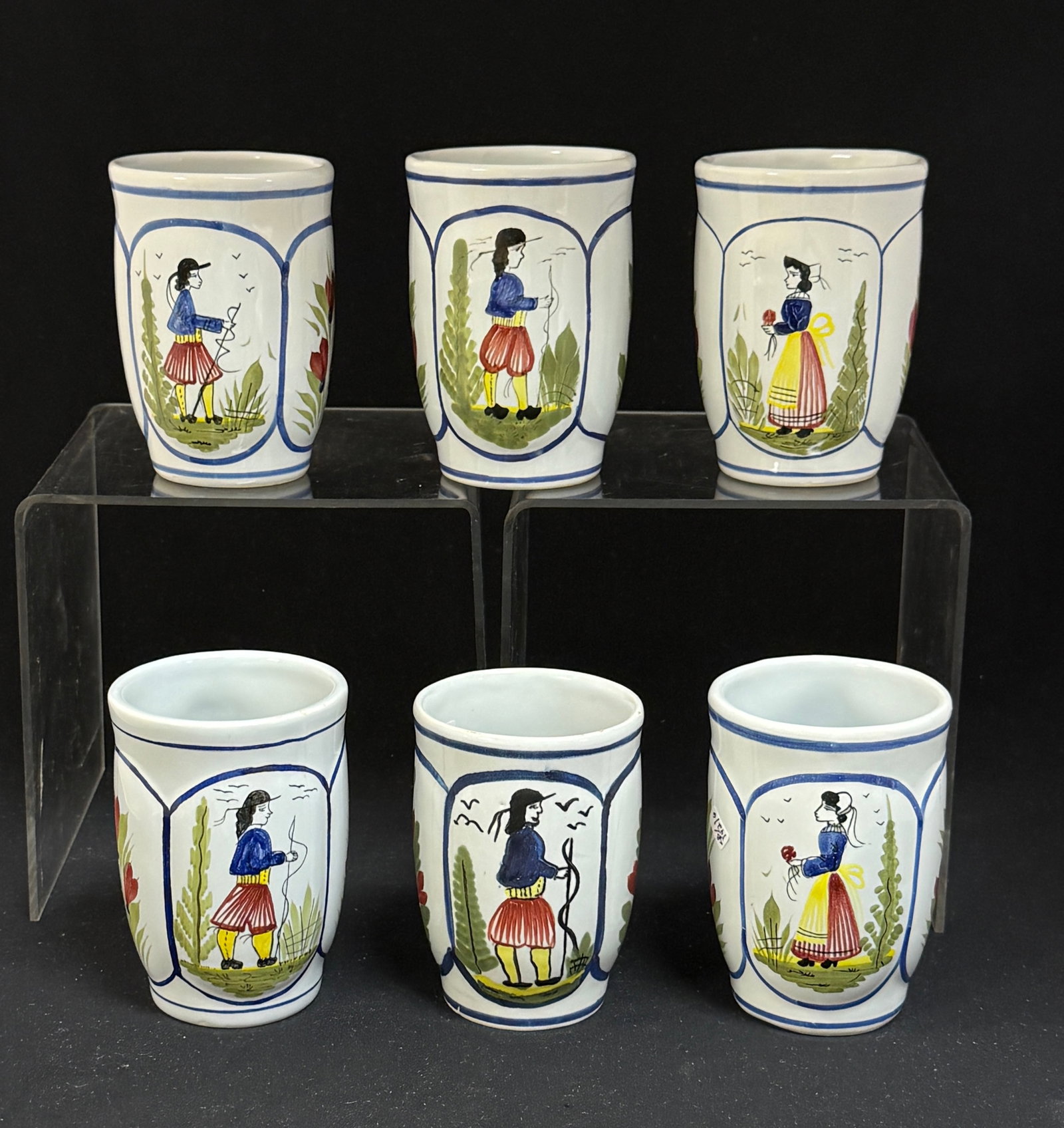6 HB HenRiot Quimper Mugs: 6 HB HenRiot Quimper Mistral mugs with Bretons; 4 1/4" circa 1984-2000. CONDITION: Quimper has propensity to have minor chips, glaze loss/wear and crazing. Jaremos attempts to call any material flaw
