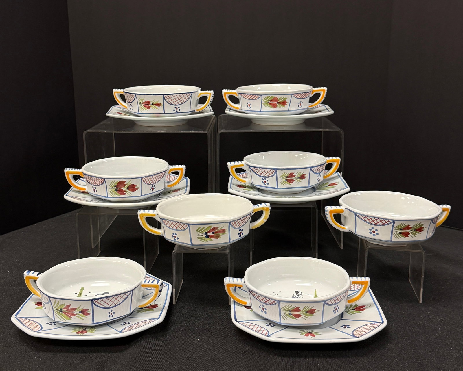 Grouping of HB HenRiot Quimper: Grouping of HB HenRiot Quimper Mistral including 8 soup bowls and 6 underplates; bowl diameter 5 1/8" circa 1984-2000. CONDITION: Quimper has propensity to have minor chips, glaze loss/wear and