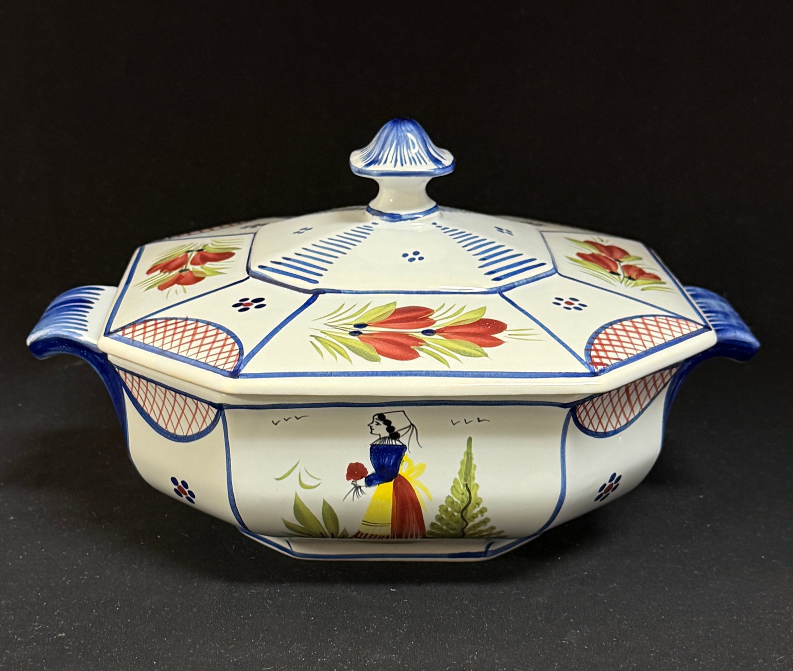 HB HenRiot Quimper Casserole: HB HenRiot Quimper octagon covered casserole with Breton figure; length 10 3/4" circa 1984-2000. CONDITION: Quimper has propensity to have minor chips, glaze loss/wear and crazing. Jaremos attempts