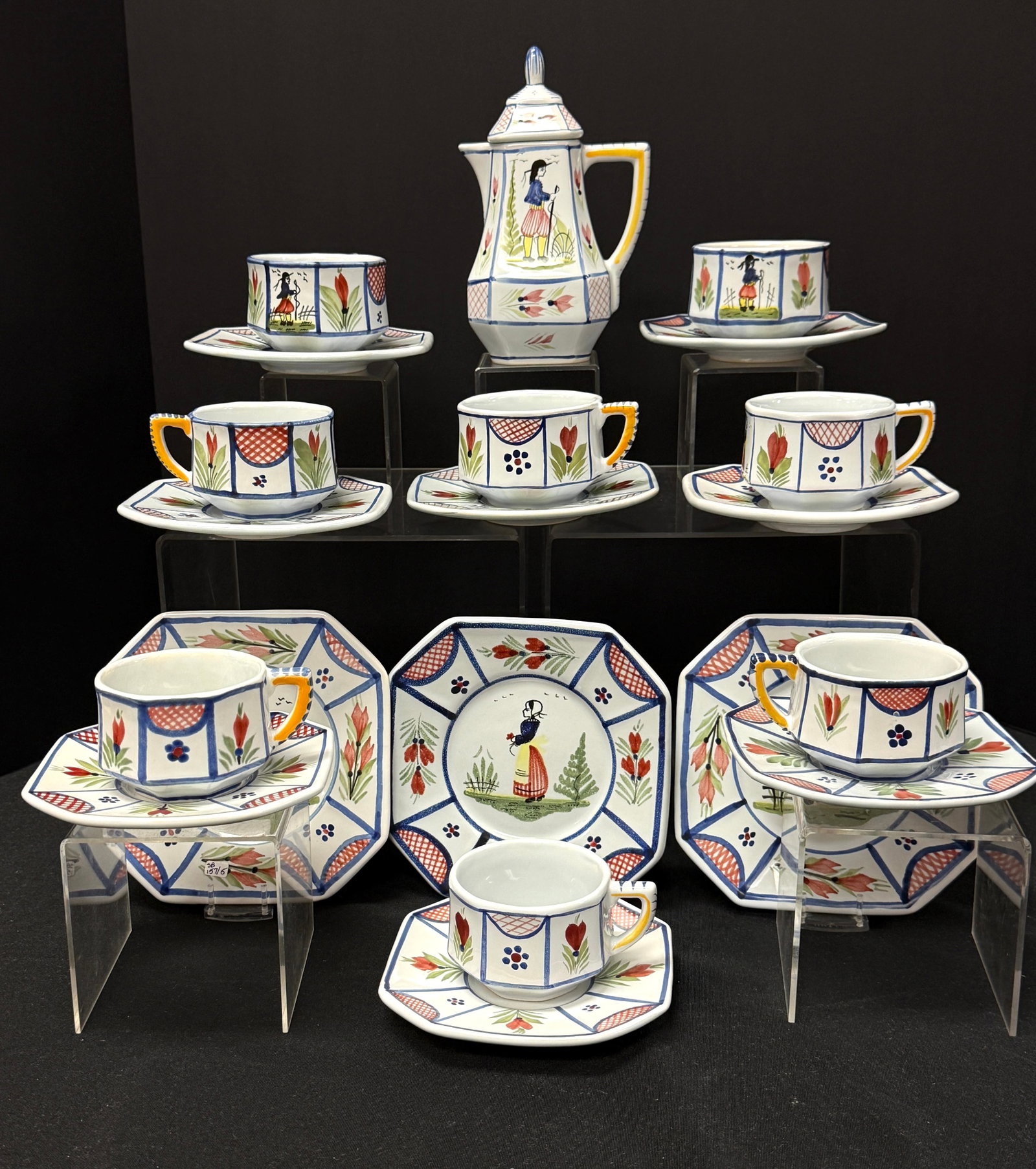 HB HenRiot Quimper Dishes: HB HenRiot Quimper dishes including a teapot, 8 cups, 8 saucers, and 3 bread and butter plates; teapot ht 7 1/2" circa 1984-2000. CONDITION: Quimper has propensity to have minor chips, glaze