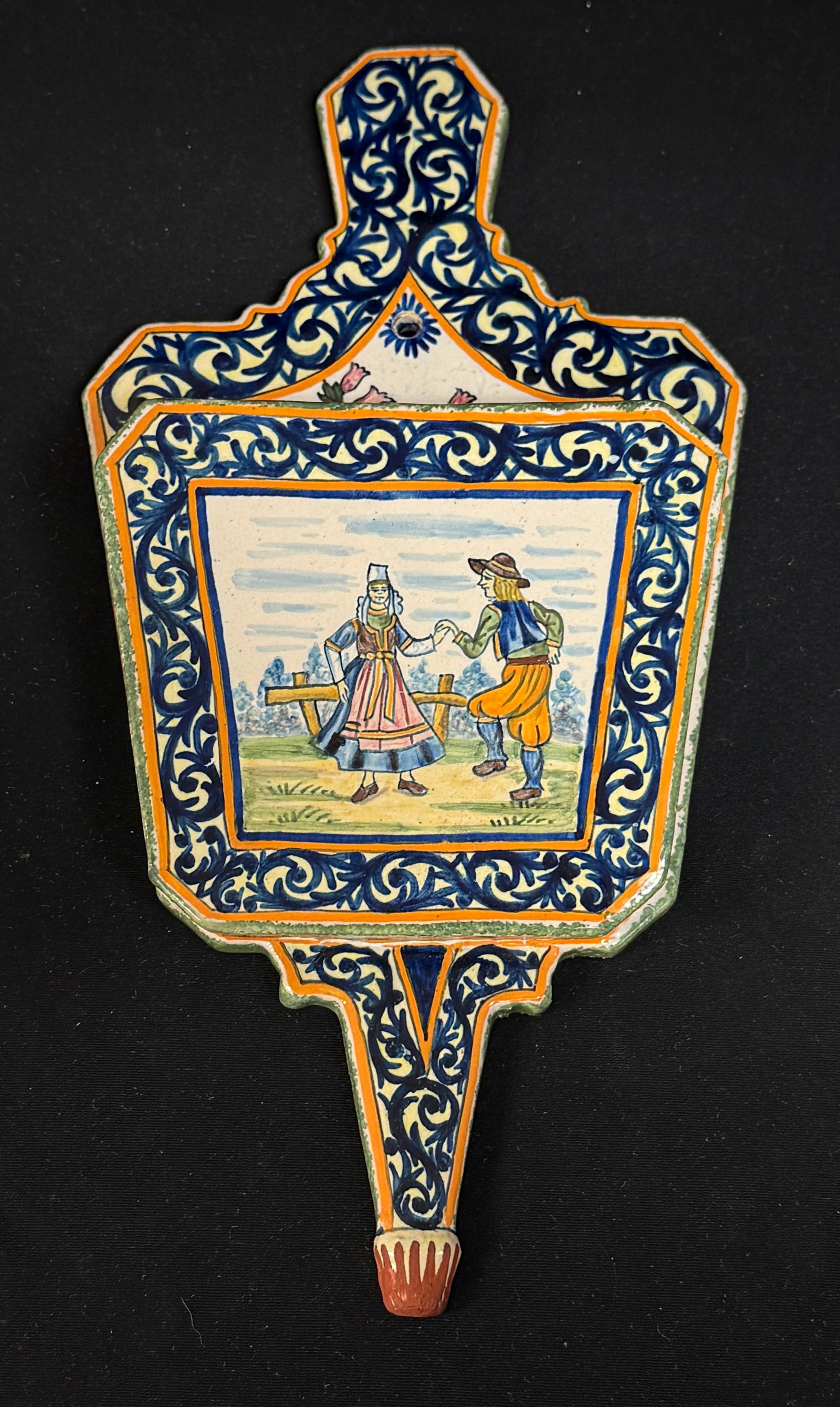 HenRiot Quimper Wall Pocket: HenRiot Quimper bellows form wall pocket, highly decorated with d?cor riche border and a spray of bruyere/heather, the central panel has Breton couple dancing in the out of doors; ht 12" circa