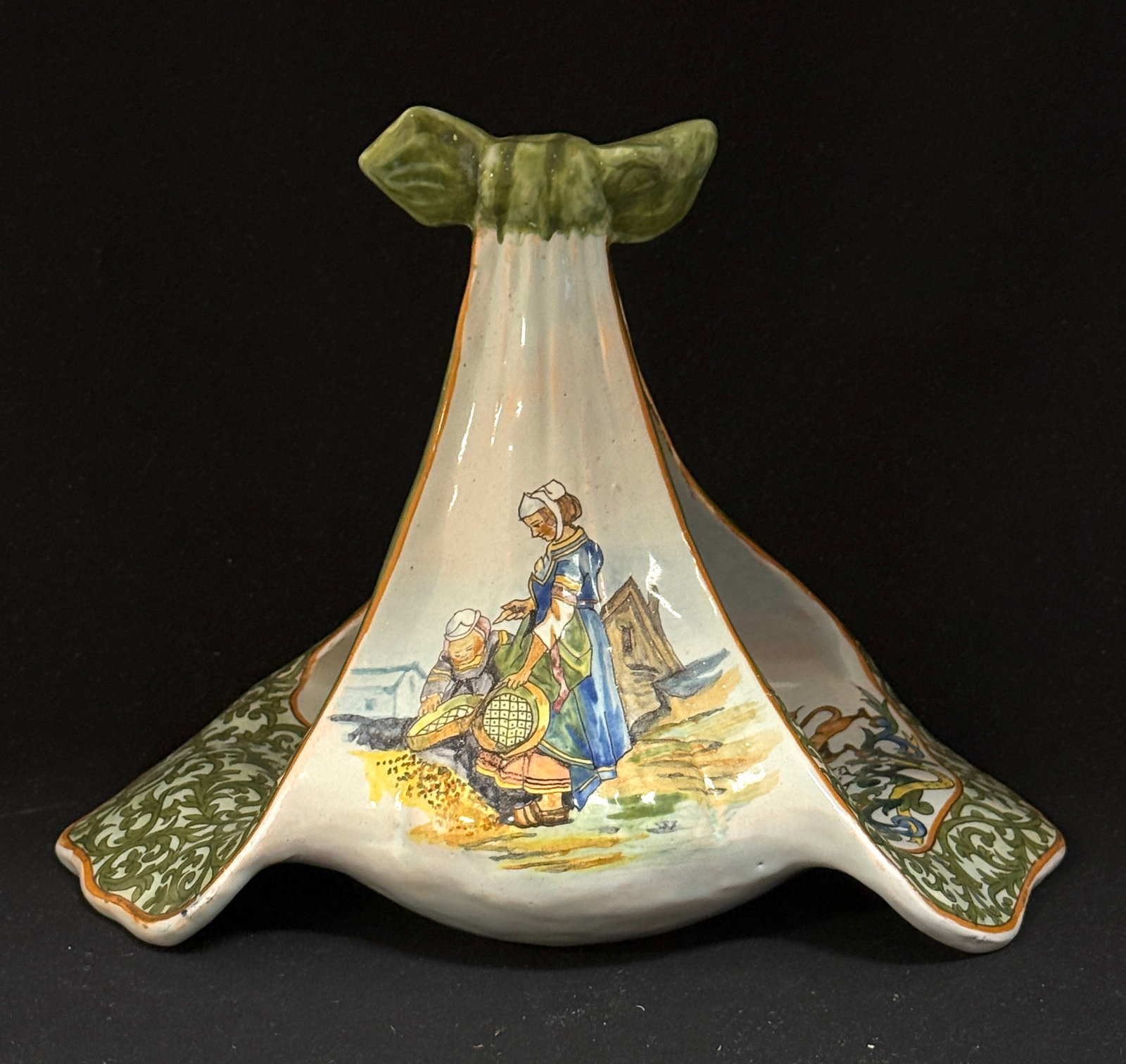 Porquier Beau Serving Piece: Porquier Beau French faience serving piece in form of knotted dinner napkin, has two toned arabesque edges flanking an interior Blason of Brittany, sides have a scene of mother and daughter and one