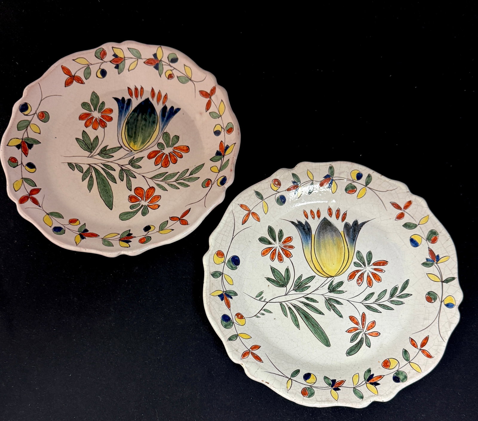 Pair Malicorne Botanical Plates: Pair of Malicorne botanical plates in vivid colors and with traditional Malicorne motif border, one marked PBX the other unmarked; diameter 9 3/4" circa 1895-1940. CONDITION: Quimper has propensity