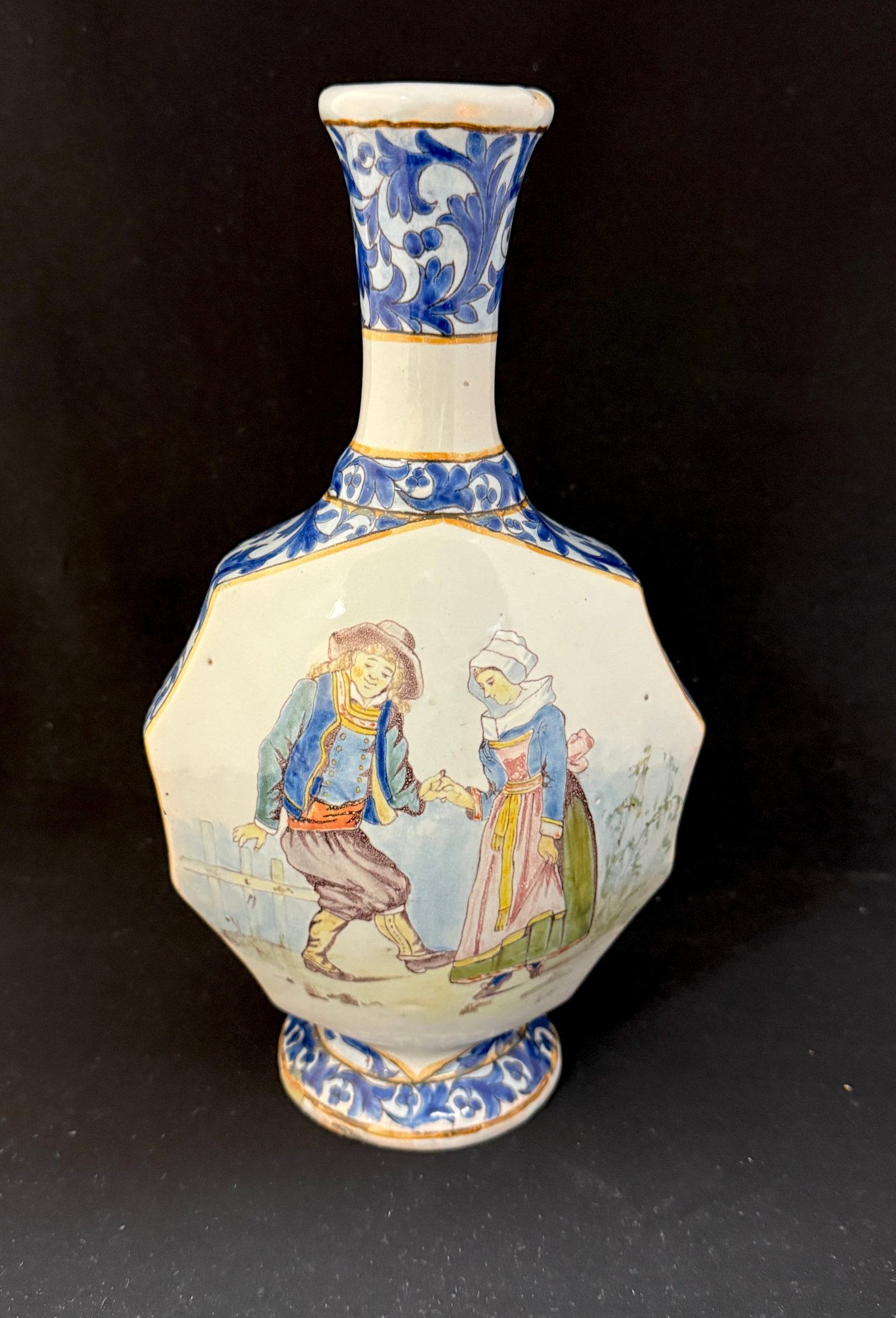 Porquier Beau Footed Vase: Porquier Beau footed vase with decor riche motif on neck, sides, and base, one panel features bluets and Japanese roses, one with dancing Breton couple; ht 11" circa 1875-1905. LITERATURE: Tome II