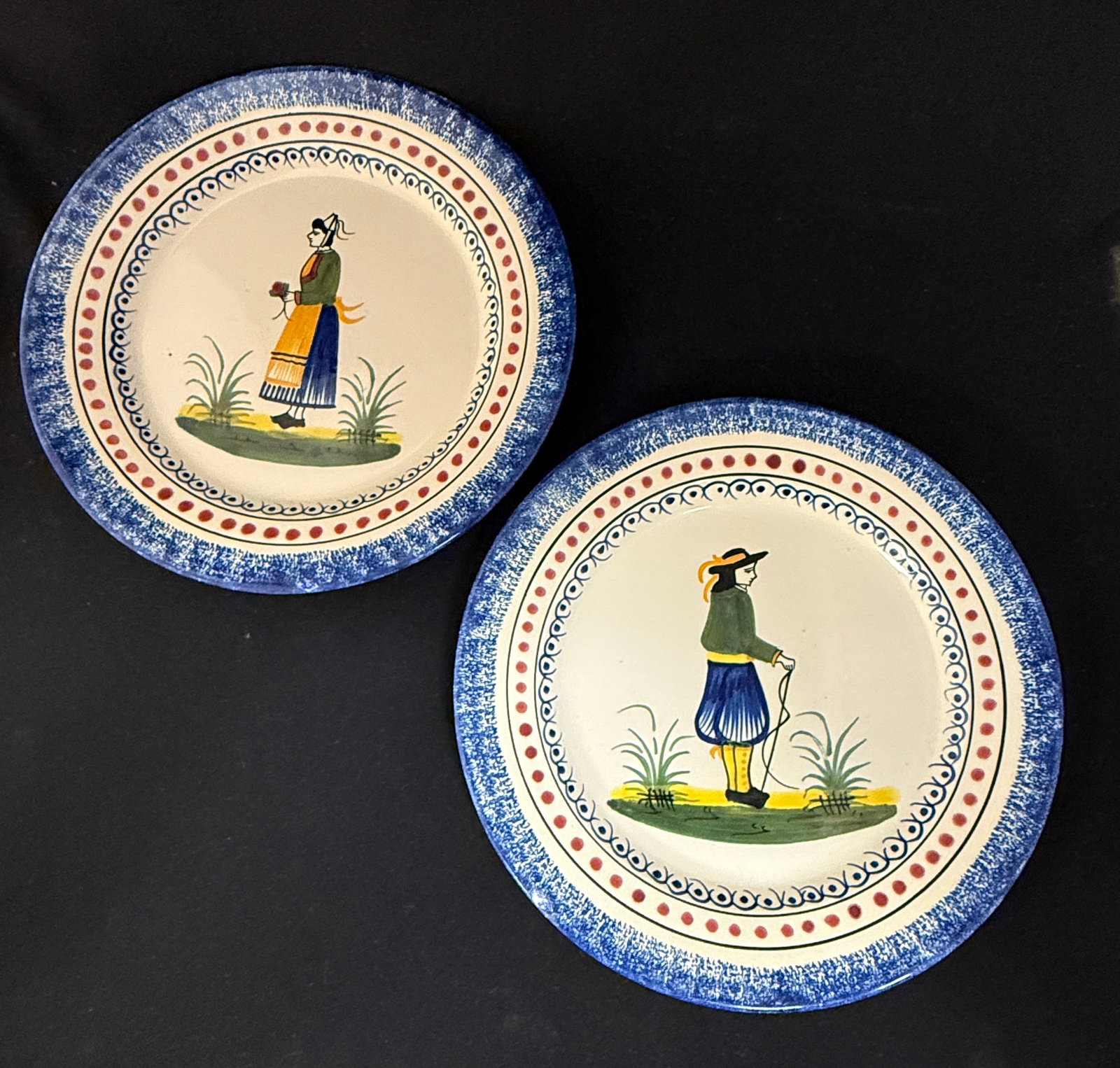 Pair of HenRiot Quimper Plates: Pair of HenRiot Quimper plates for Neiman-Marcus imported from France during Neiman's French Fortnights; diameter 10 1/2" circa Mid 20th century. CONDITION: Quimper has propensity to have minor