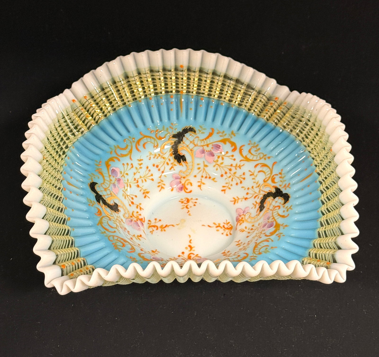 Square/Ruffle Top Bride's Bowl: Square vaseline/uranium glass enameled pinched shape Bride's bowl with ruffle rim; diameter 9 1/2". PROVENANCE: Carol Lange, granddaughter of William Davidson founder of Harley Davidson. CONDITION: