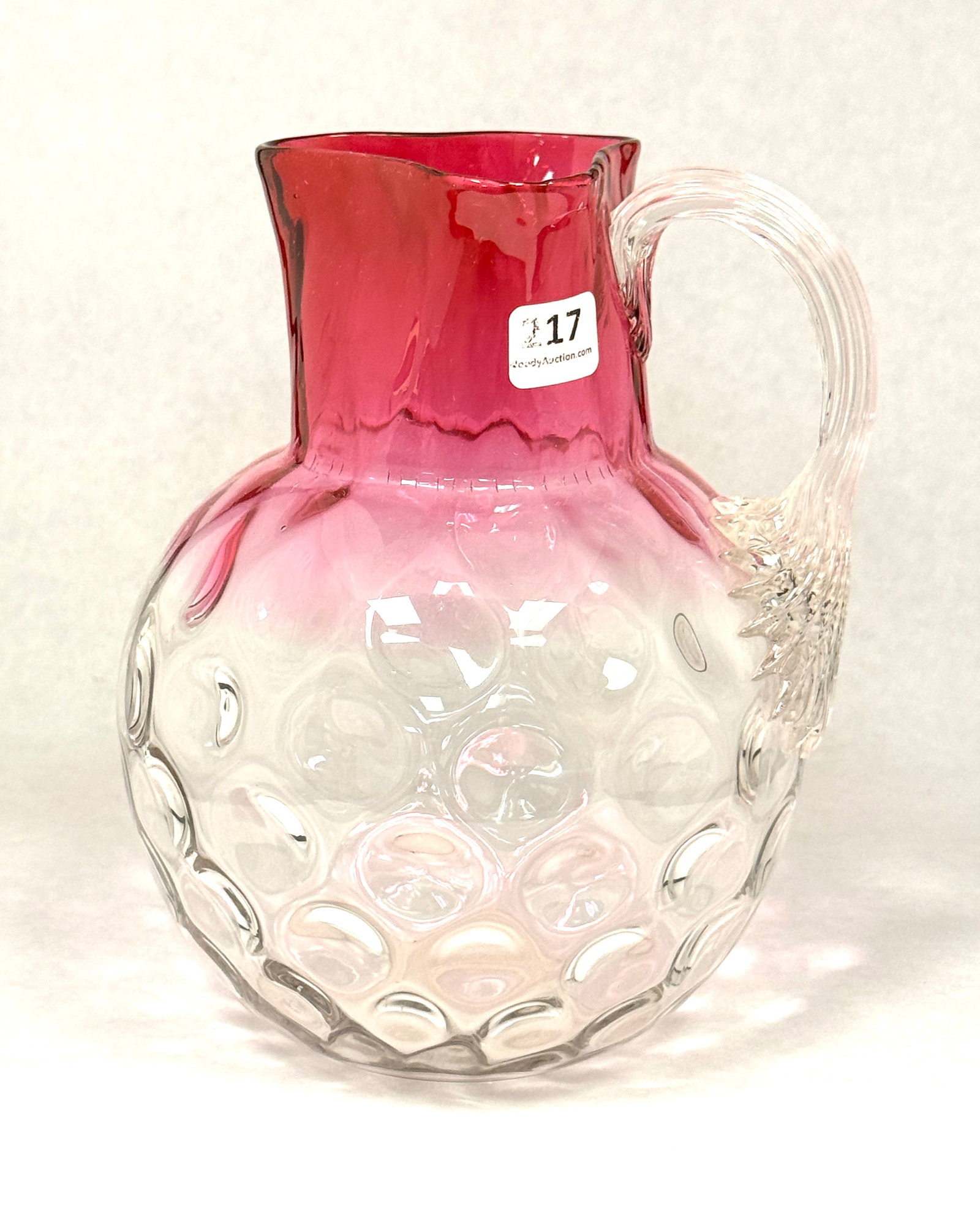Rubina Coinspot Water Pitcher: Rubina Coinspot water pitcher with a reeded handle, 8 1/2" ht. PROVENANCE: Woodys Auction CONDITION: no chips, cracks, repairs or material defects found, Jaremos attempts to call any material flaw