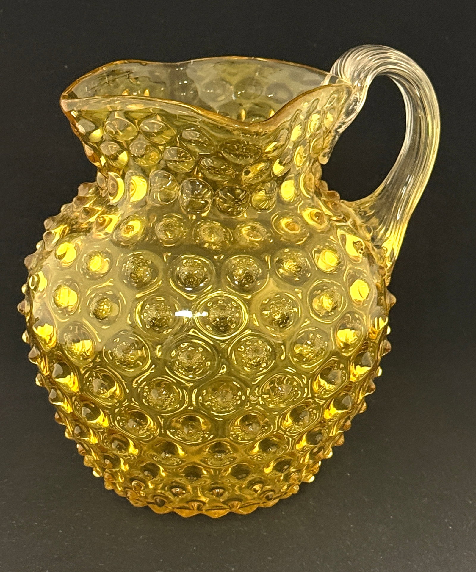 Canary Hobnail Water Pitcher: Canary Hobnail Water pitcher with a clear reeded handle, 7 1/2" ht. CONDITION: no chips, cracks, repairs or material defects found, Jaremos attempts to call any material flaw that affects the price,