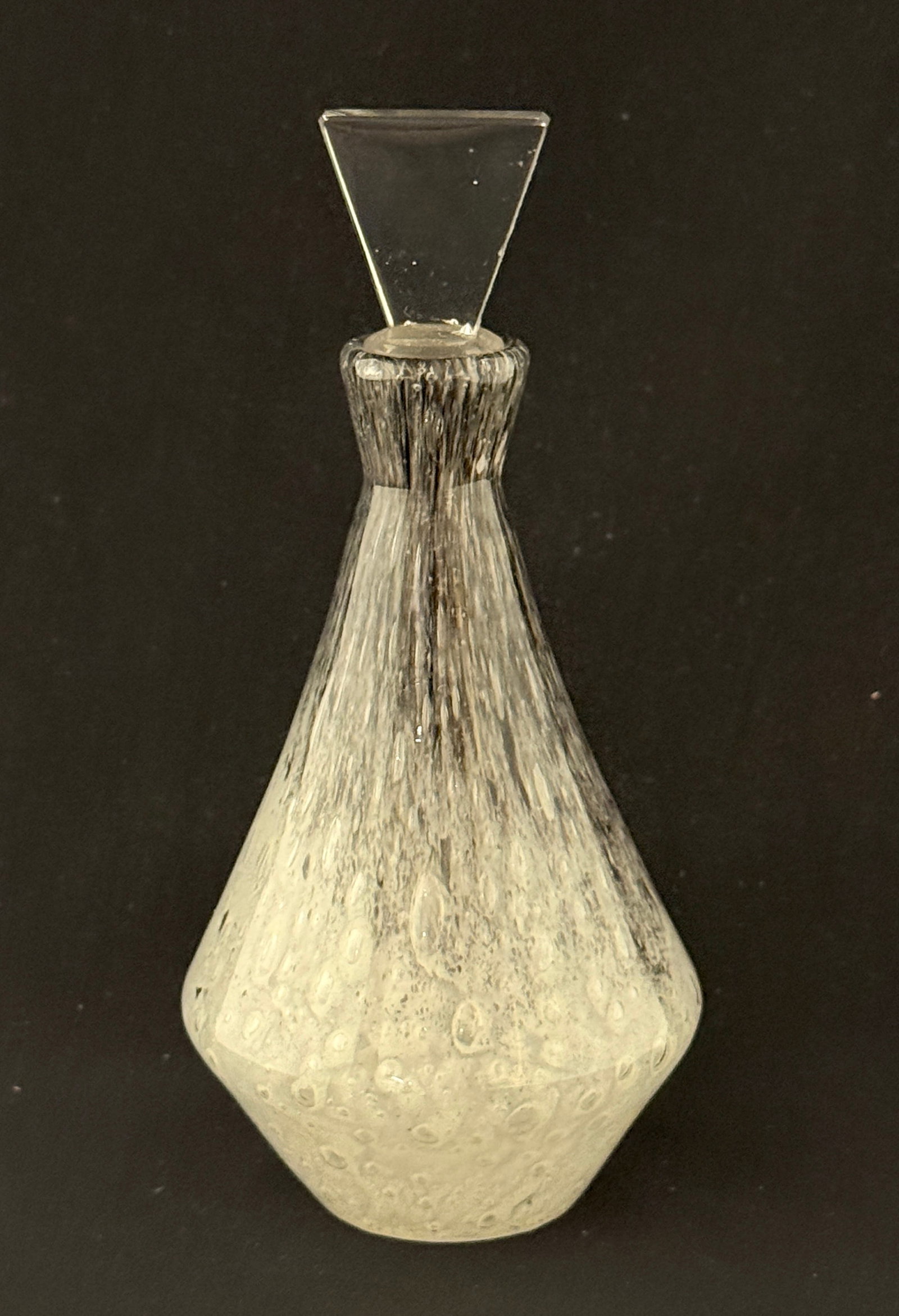 Steuben Black Cluthra Perfume: Steuben Black Cluthra conical perfume bottle with an Art Deco stopper, 7" ht. CONDITION: no chips, cracks, repairs, or material defects found, Jaremos attempts to call any material flaw that affects t